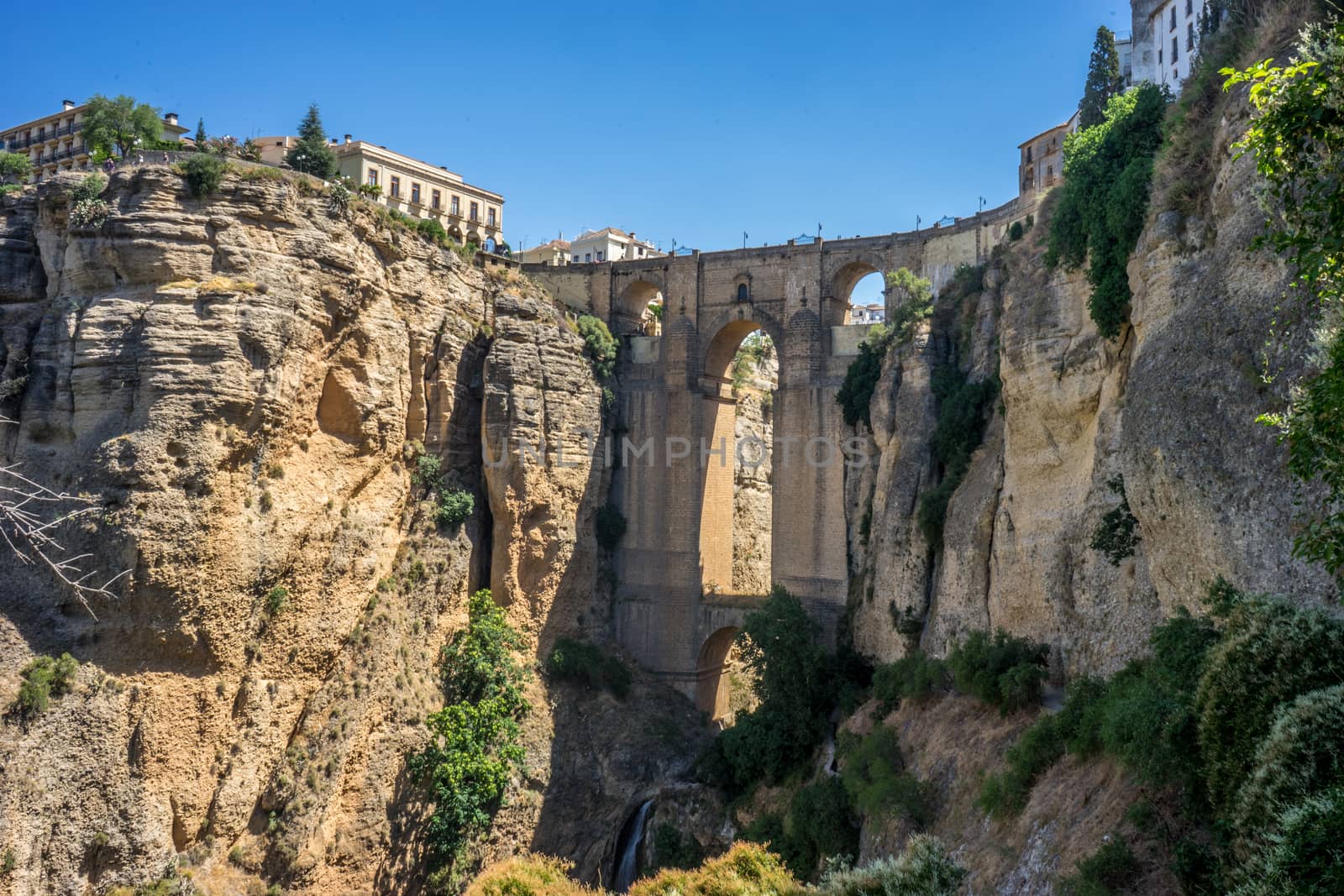 A gorge in the city of Ronda Spain, Europe on a hot summer day by ramana16