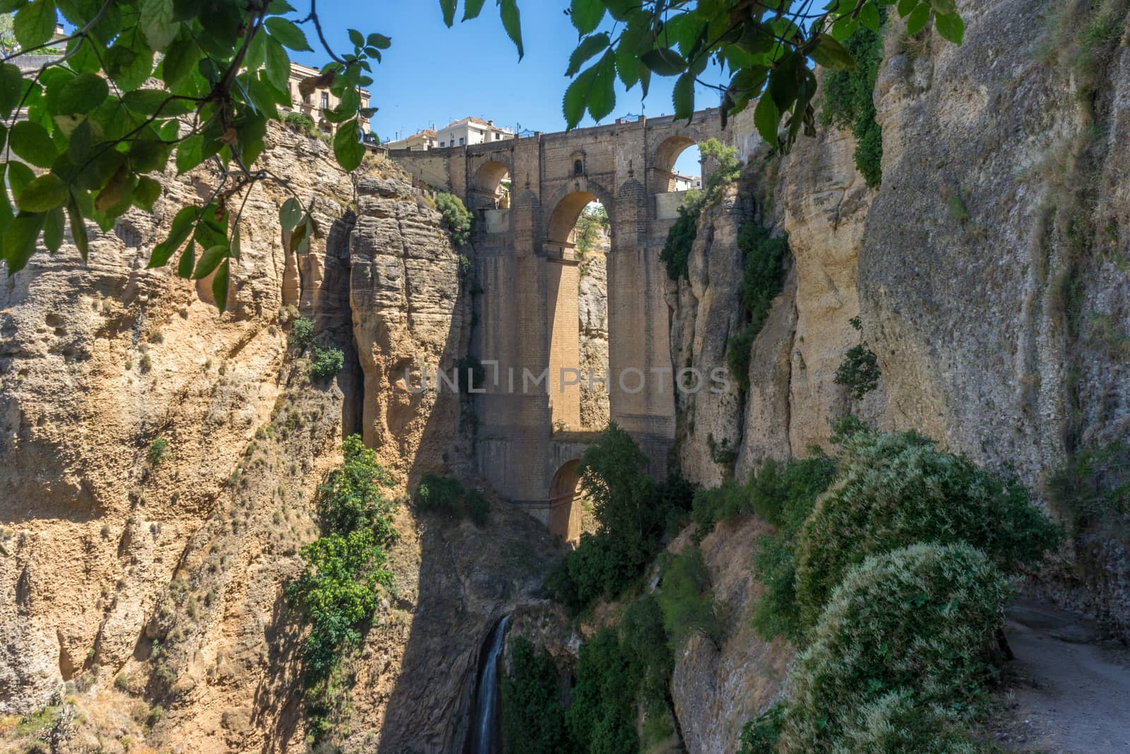 A gorge in the city of Ronda Spain, Europe on a hot summer day with clear blue skies