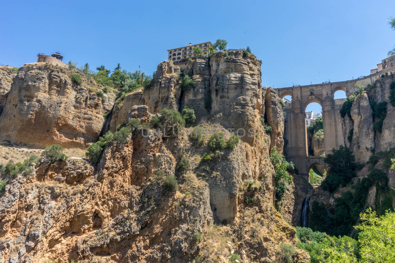 A gorge in the city of Ronda Spain, Europe on a hot summer day with clear blue skies