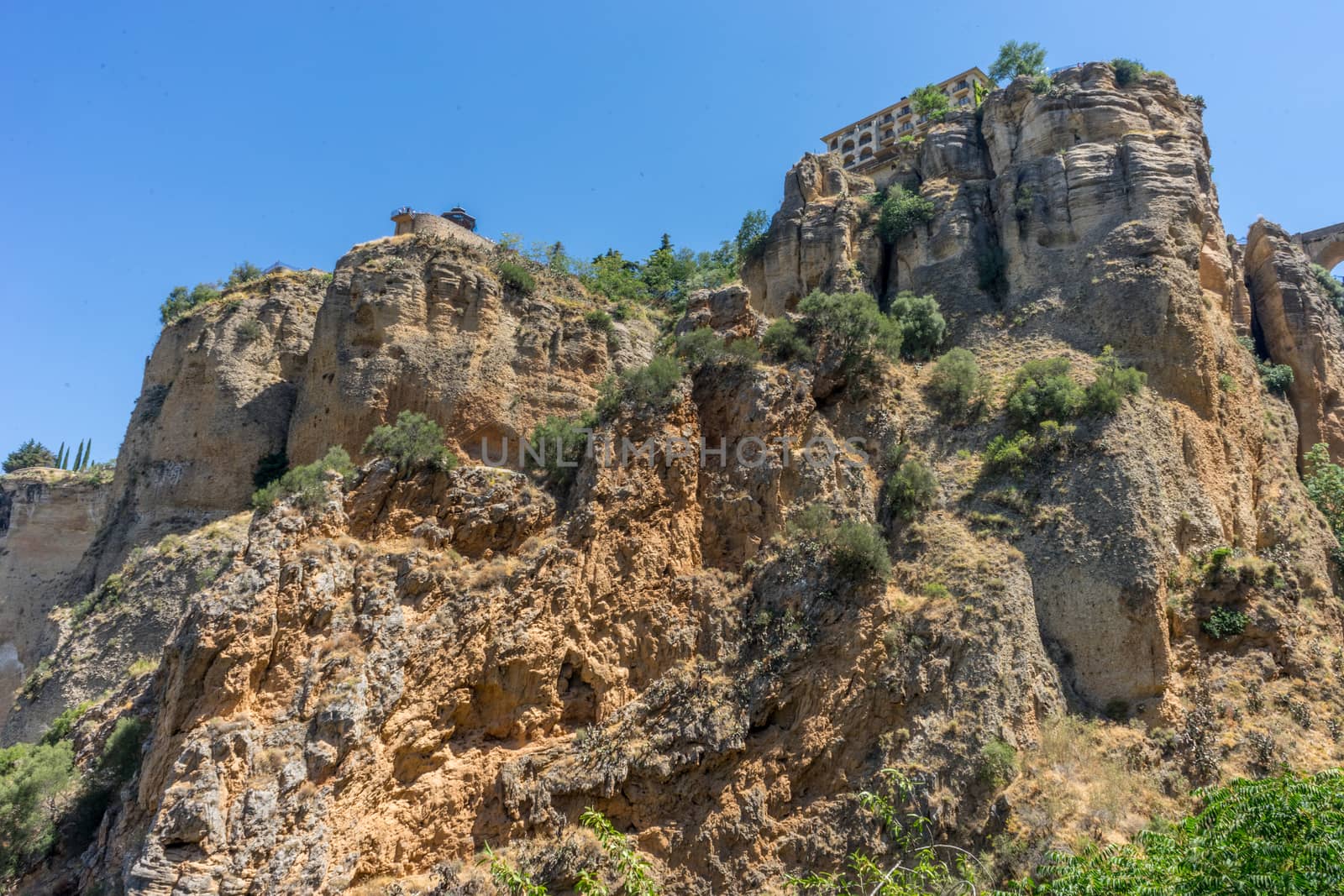 A gorge in the city of Ronda Spain, Europe on a hot summer day with clear blue skies