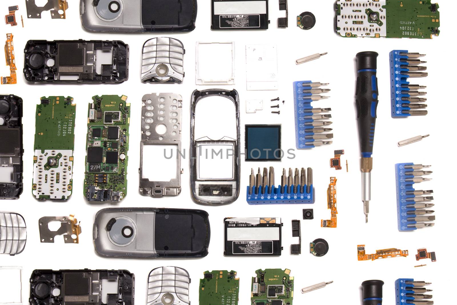 Disassembled mobile phone parts isolated on a white background.
