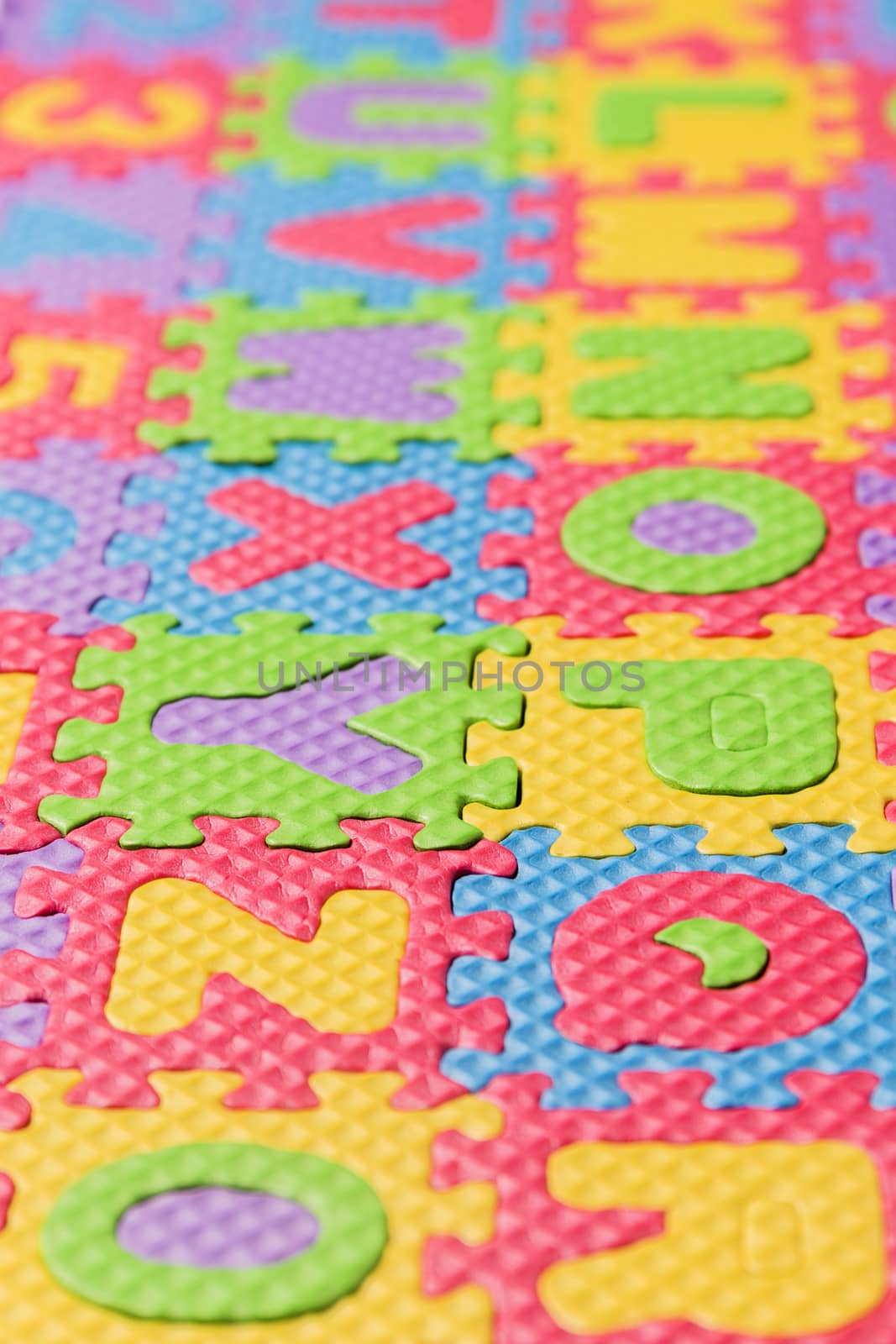 Close up view of foam puzzle letter uppercase game.