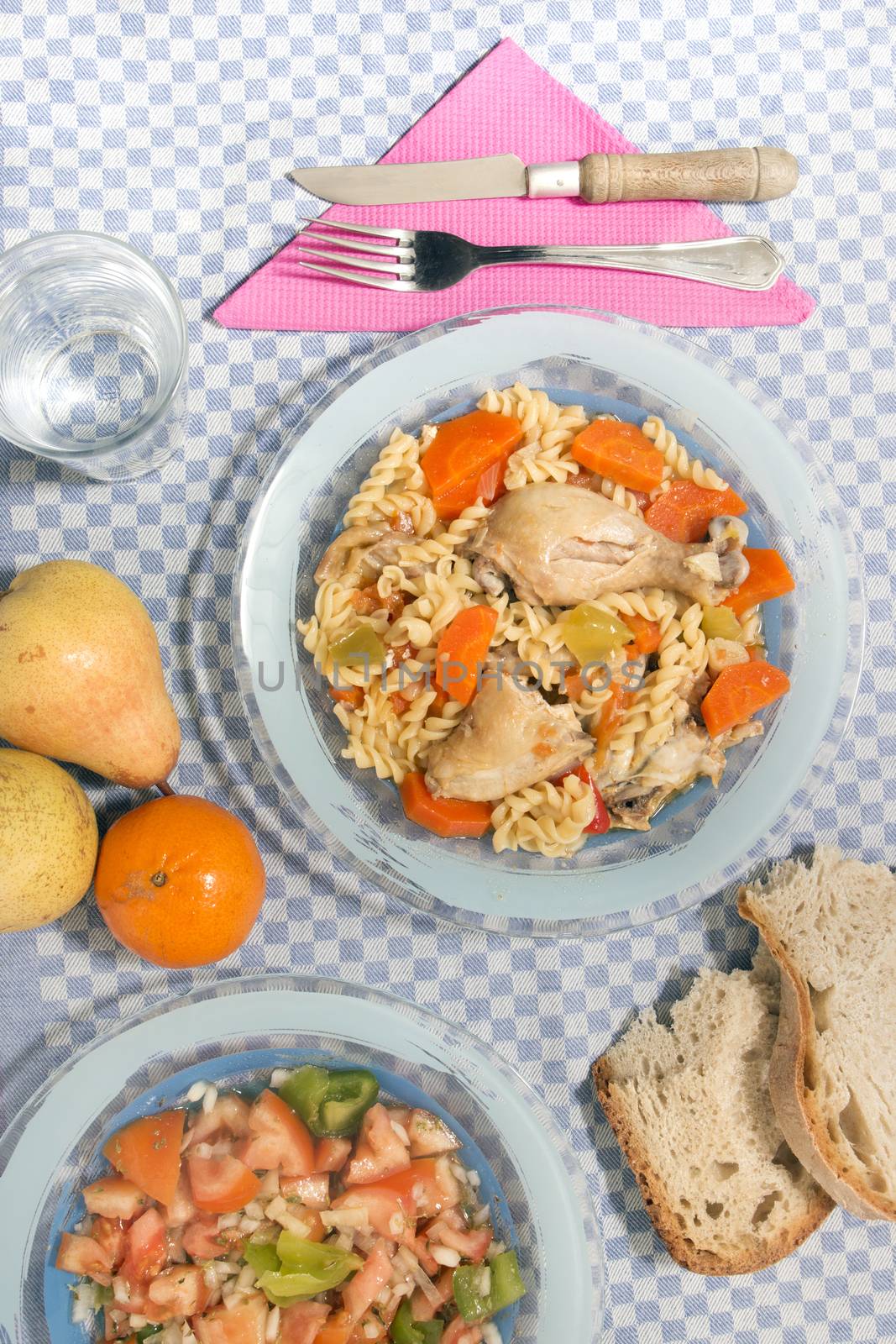 Typical Portuguese meal of Chicken with carrot and spaghetti.