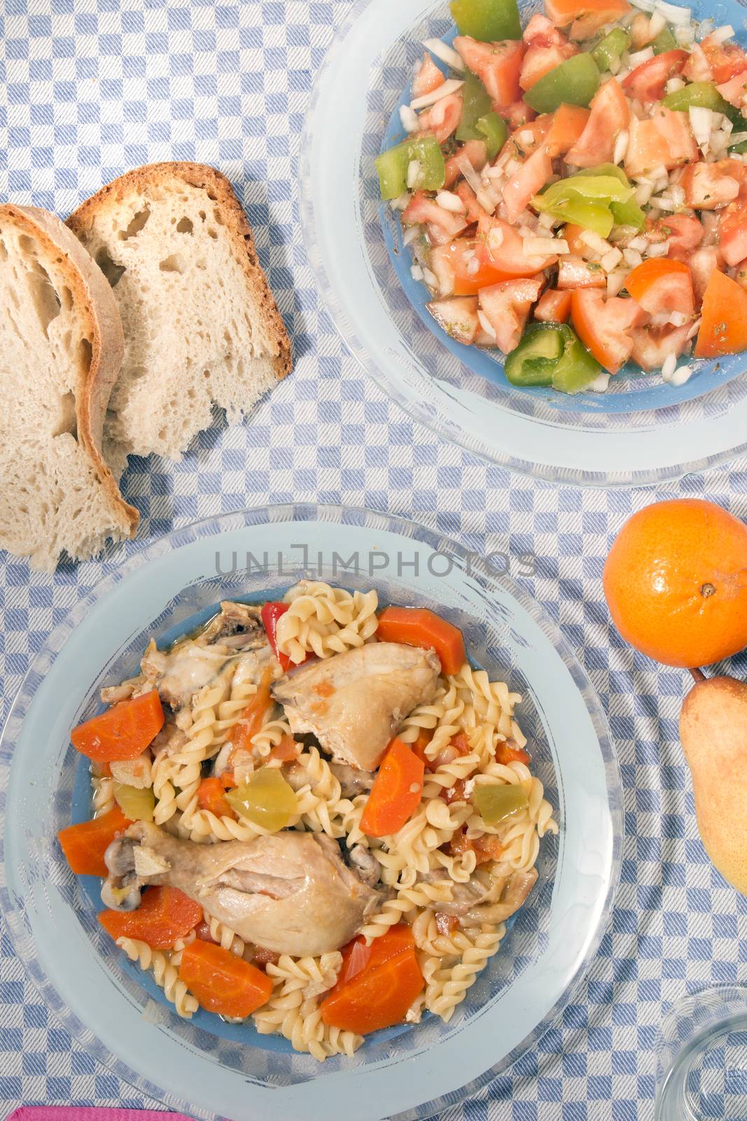 Typical Portuguese meal of Chicken with carrot and spaghetti.