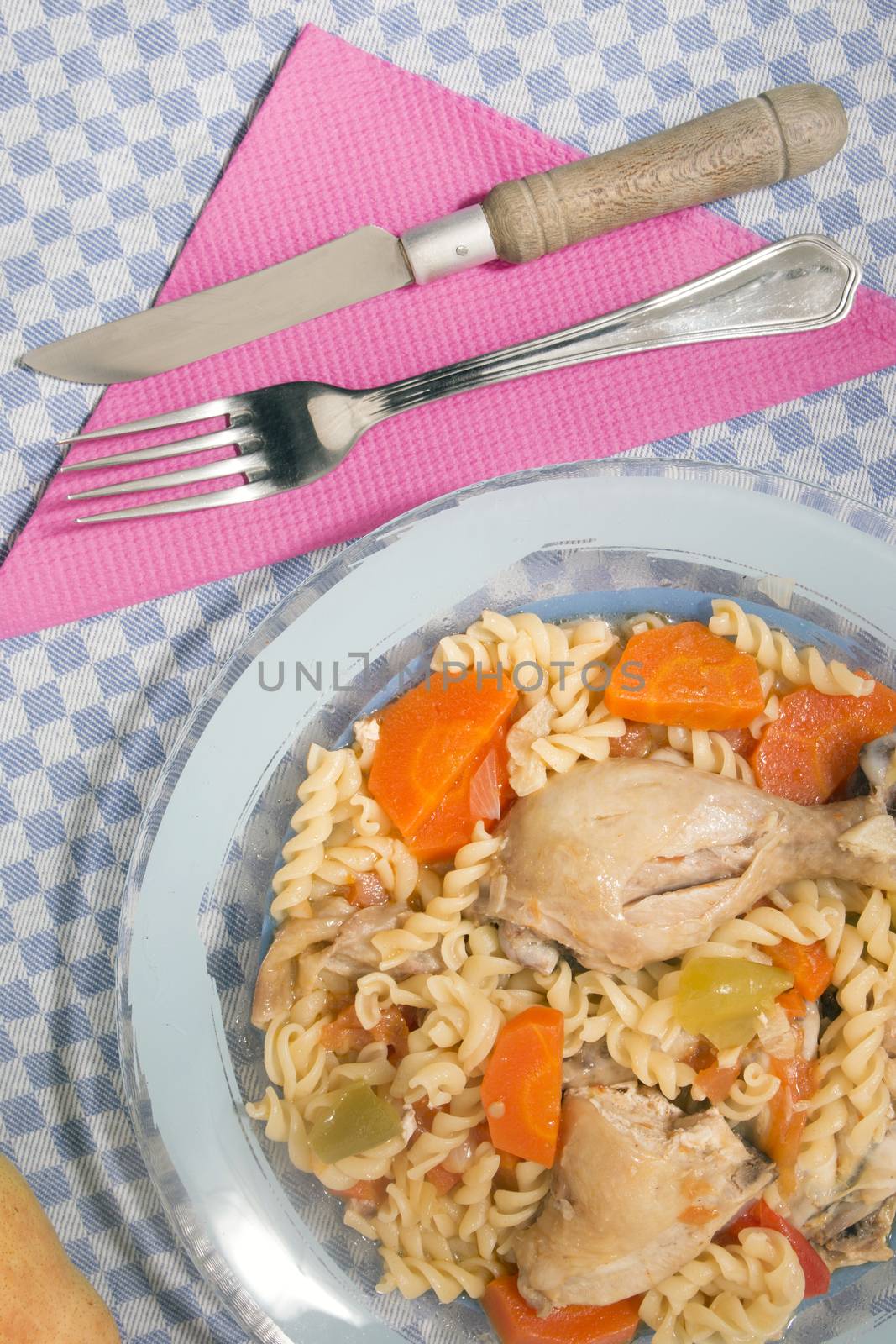 Typical Portuguese meal of Chicken with carrot and spaghetti.