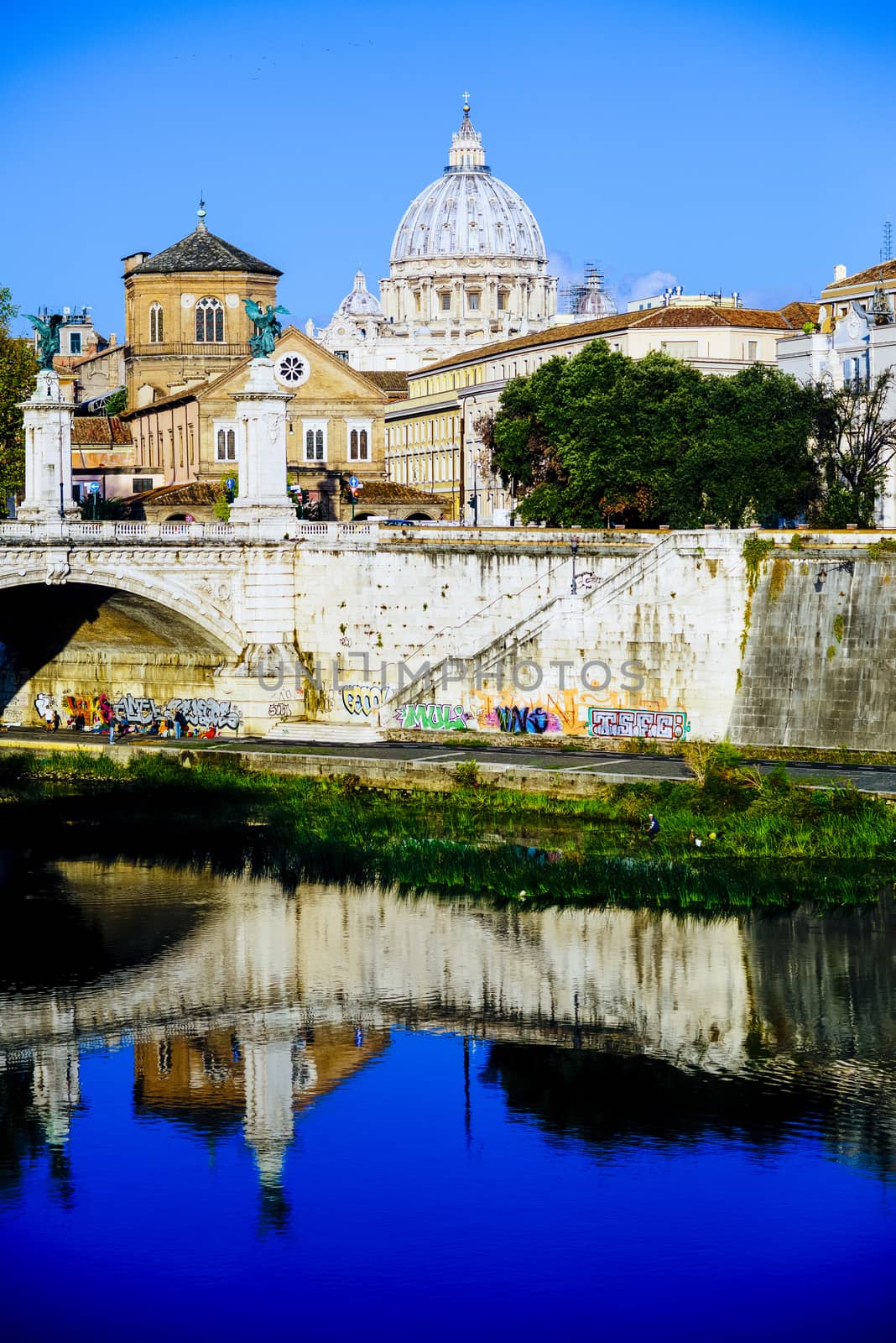 Italy, Rome, City of the Vatican dome of San Pietro seen from the bridge over the Tiber River