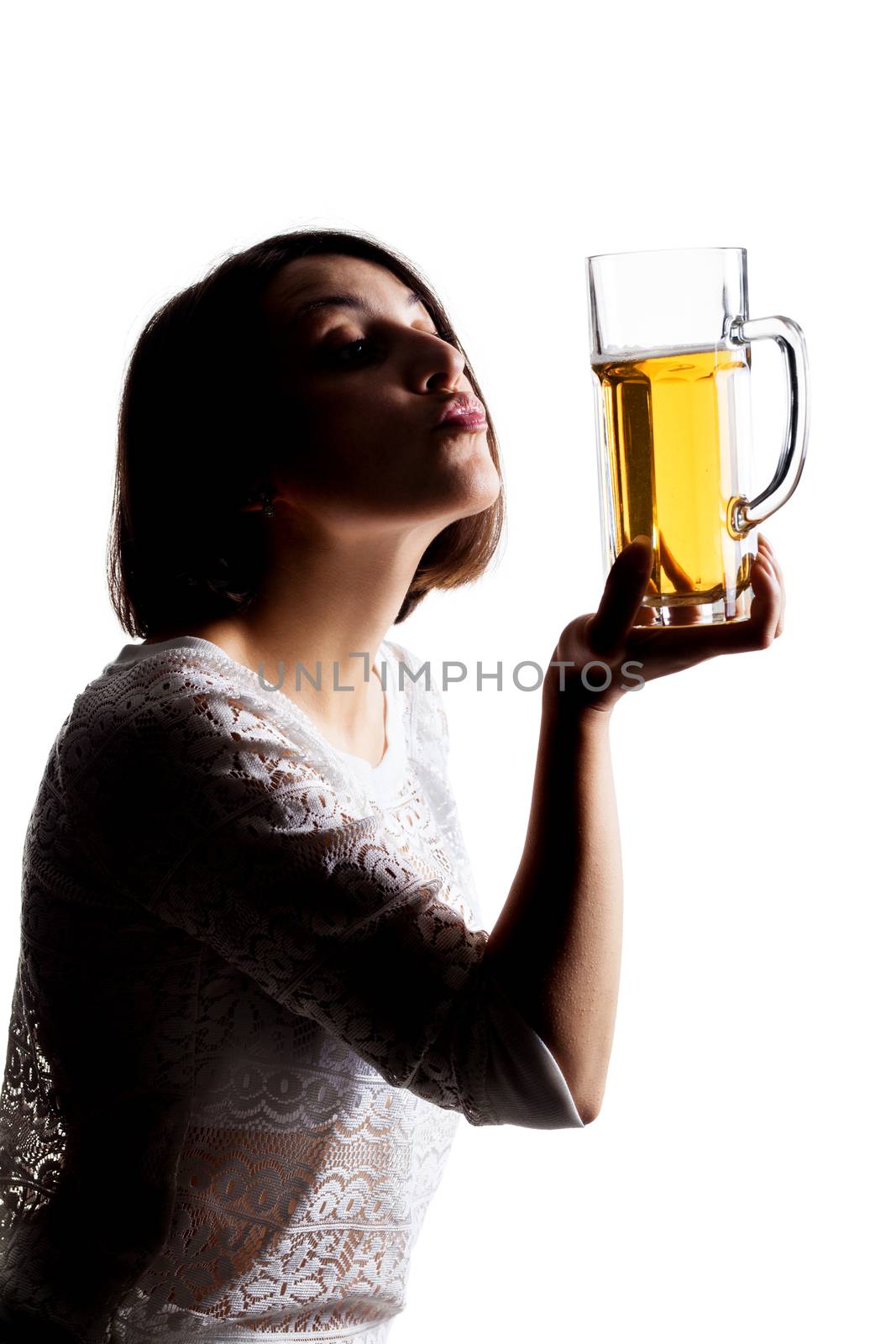 girl kissing a beer mug against white background, making duckface, half silhouette