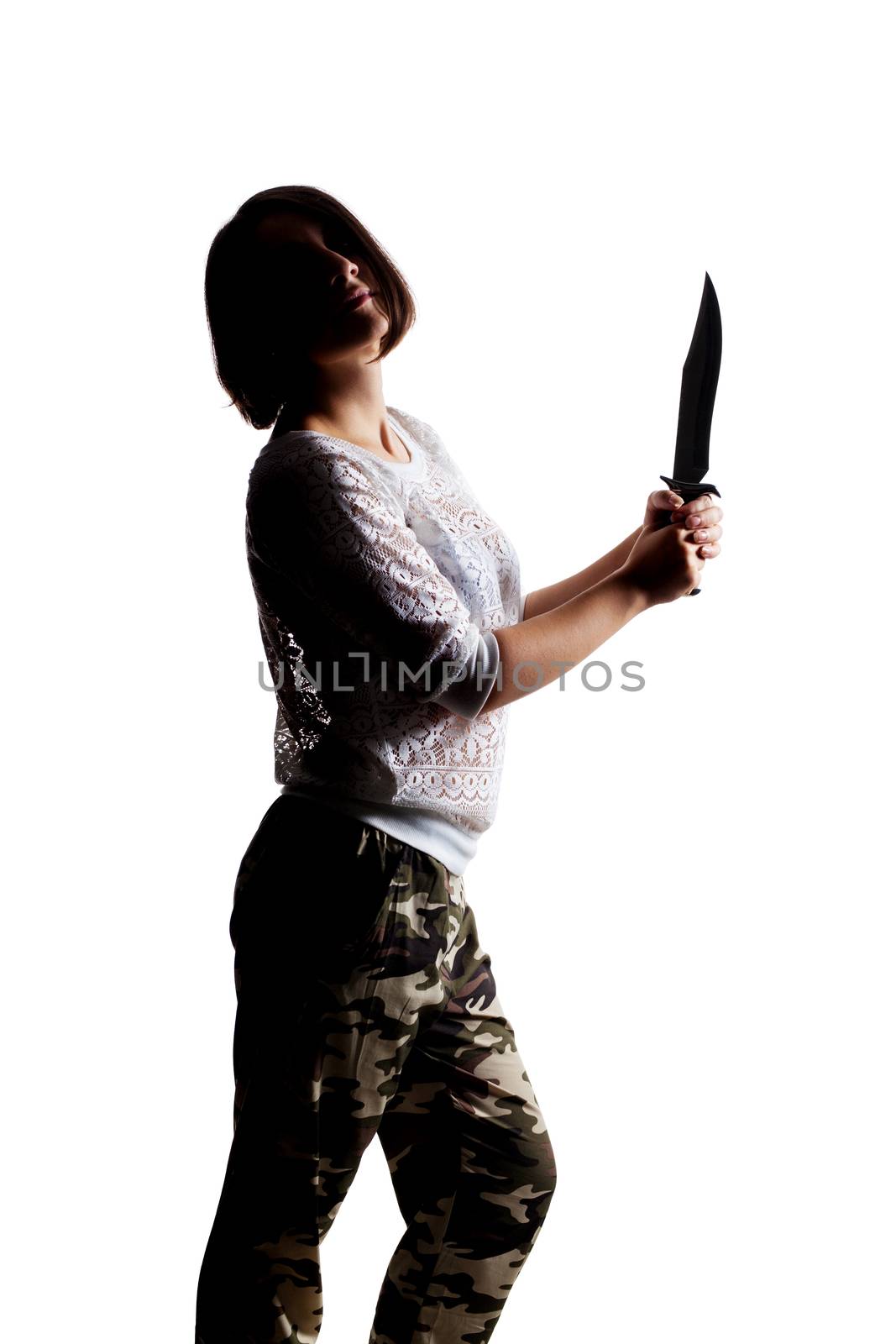 half silhouette girl holding an army knife