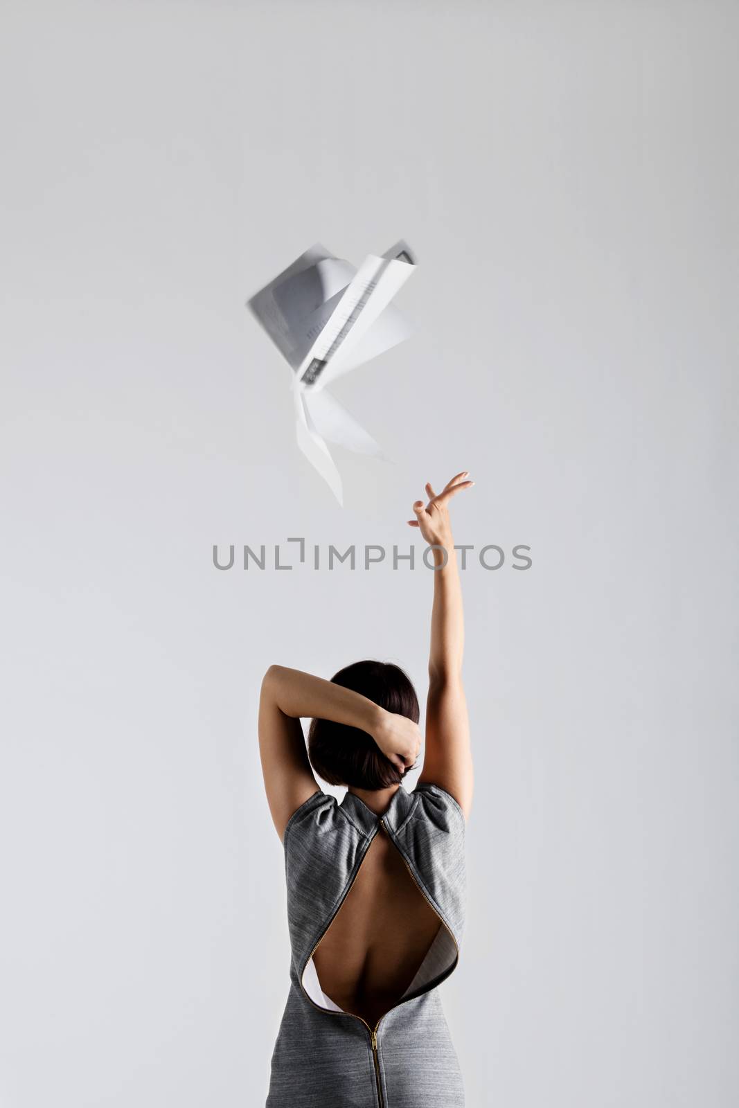 girl throwing papers by kokimk