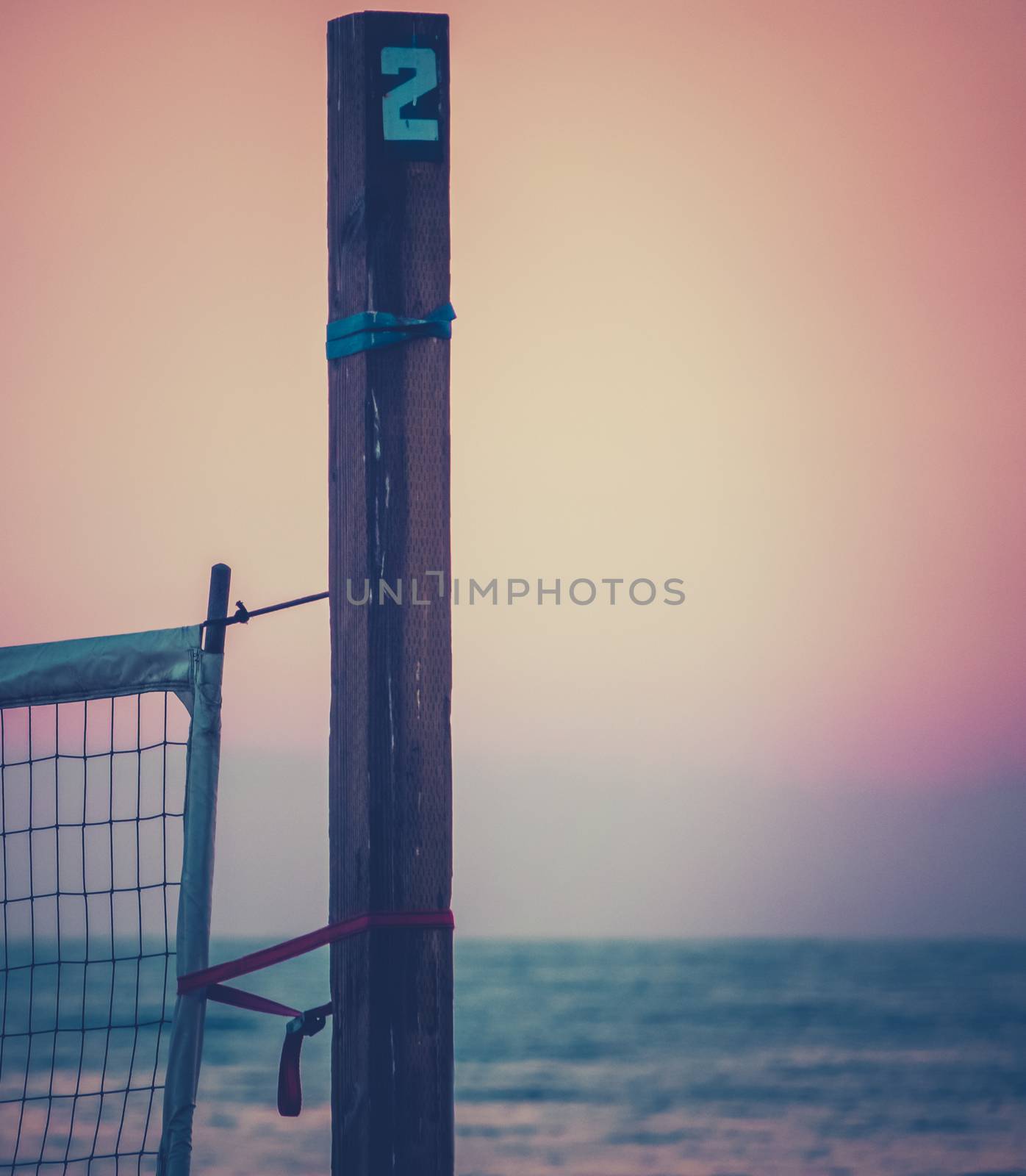 Sports Image Of A Beach Volleyball Net On A Californian Beach At Sunset With Copy Space