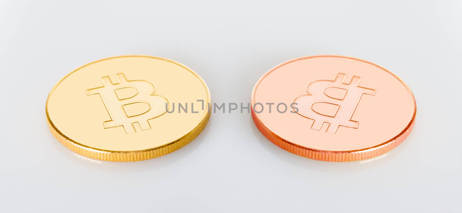 two bitcoins crypt money on a white background