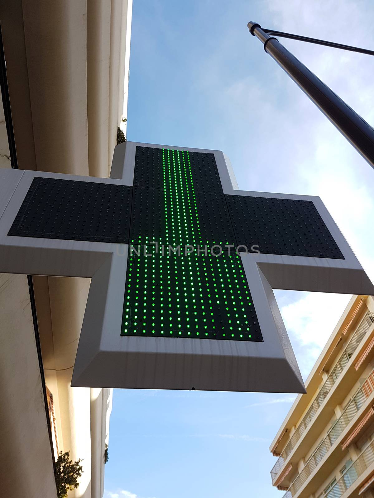 French Pharmacy Green Cross Sign or Drug Store Symbol