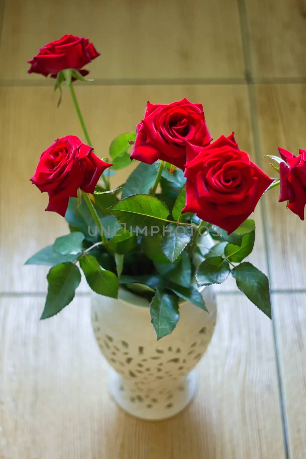 bouquet of roses in a vase of glass, interior decoration