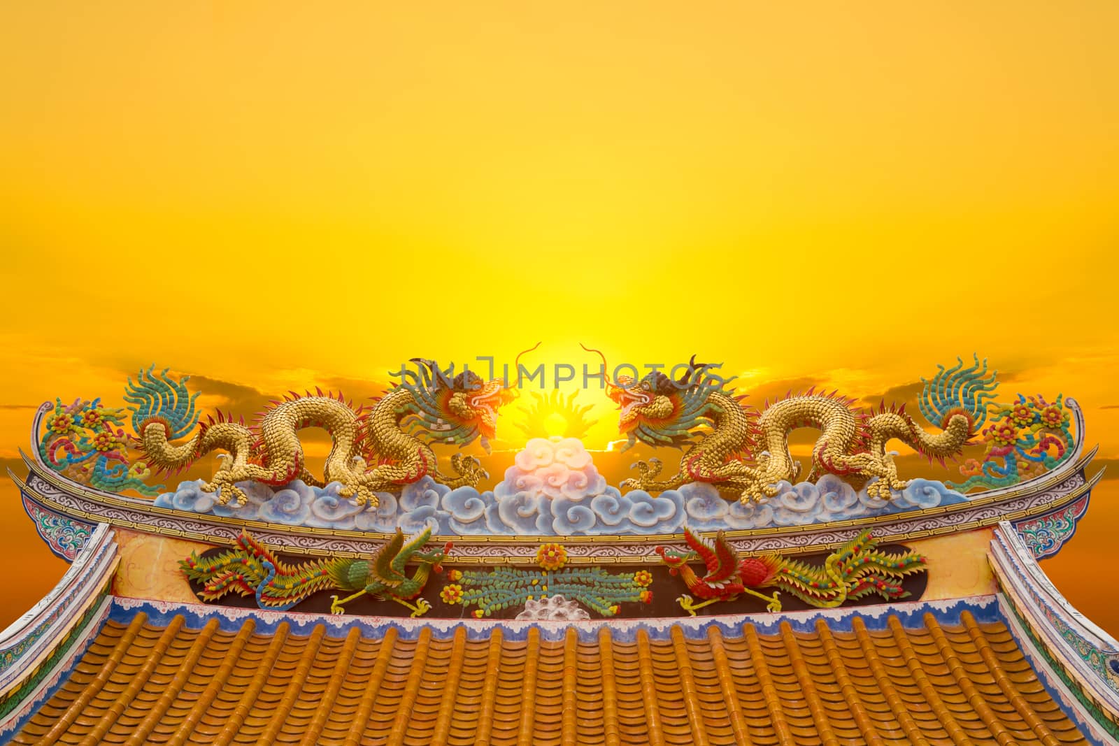 Beautiful chinese dragon statue with sun light background.