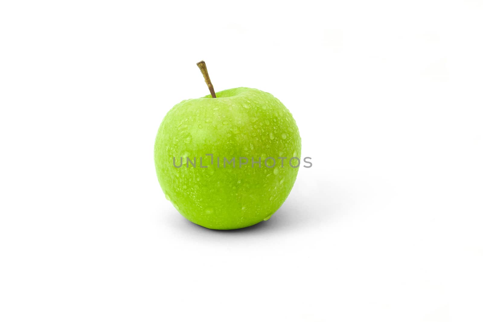 Fresh green Granny Smith apple sprayed with waterdrops - isolated on a white background