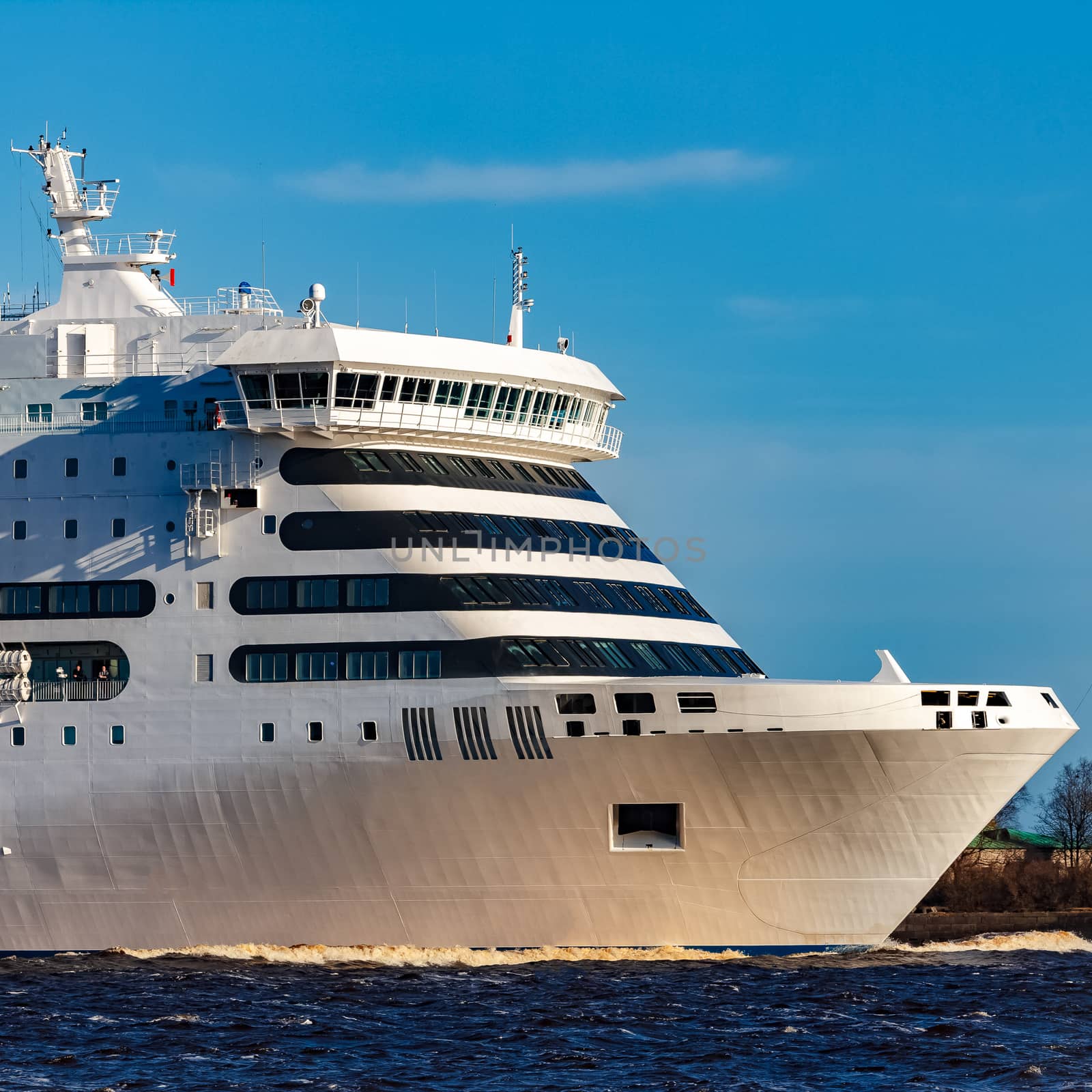 White cruise liner sailing on a clear day