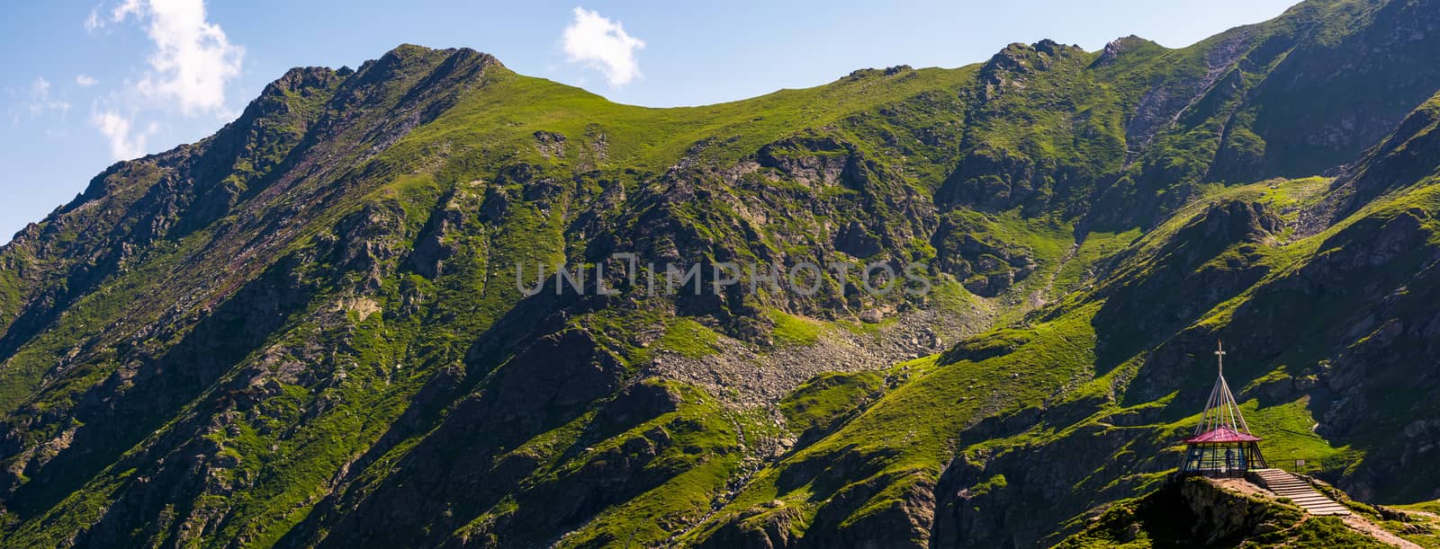 rocky mountain ridge with grassy slopes. lovely nature background