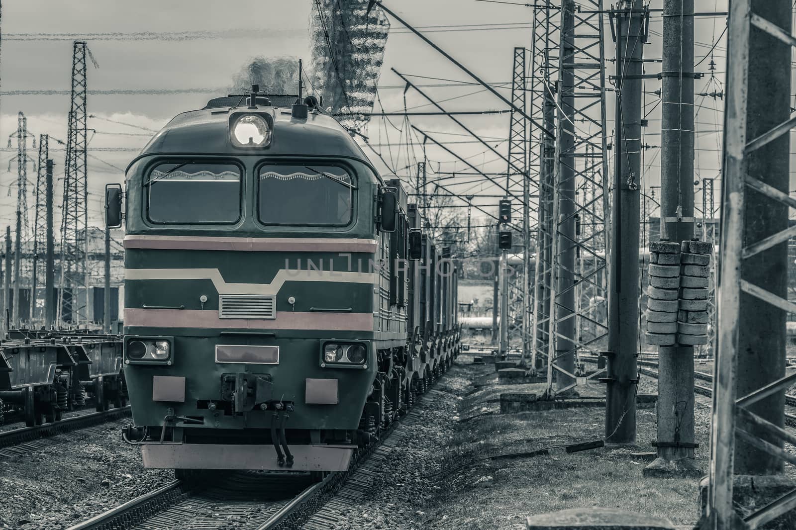 Old diesel cargo locomotive. Freight train in action