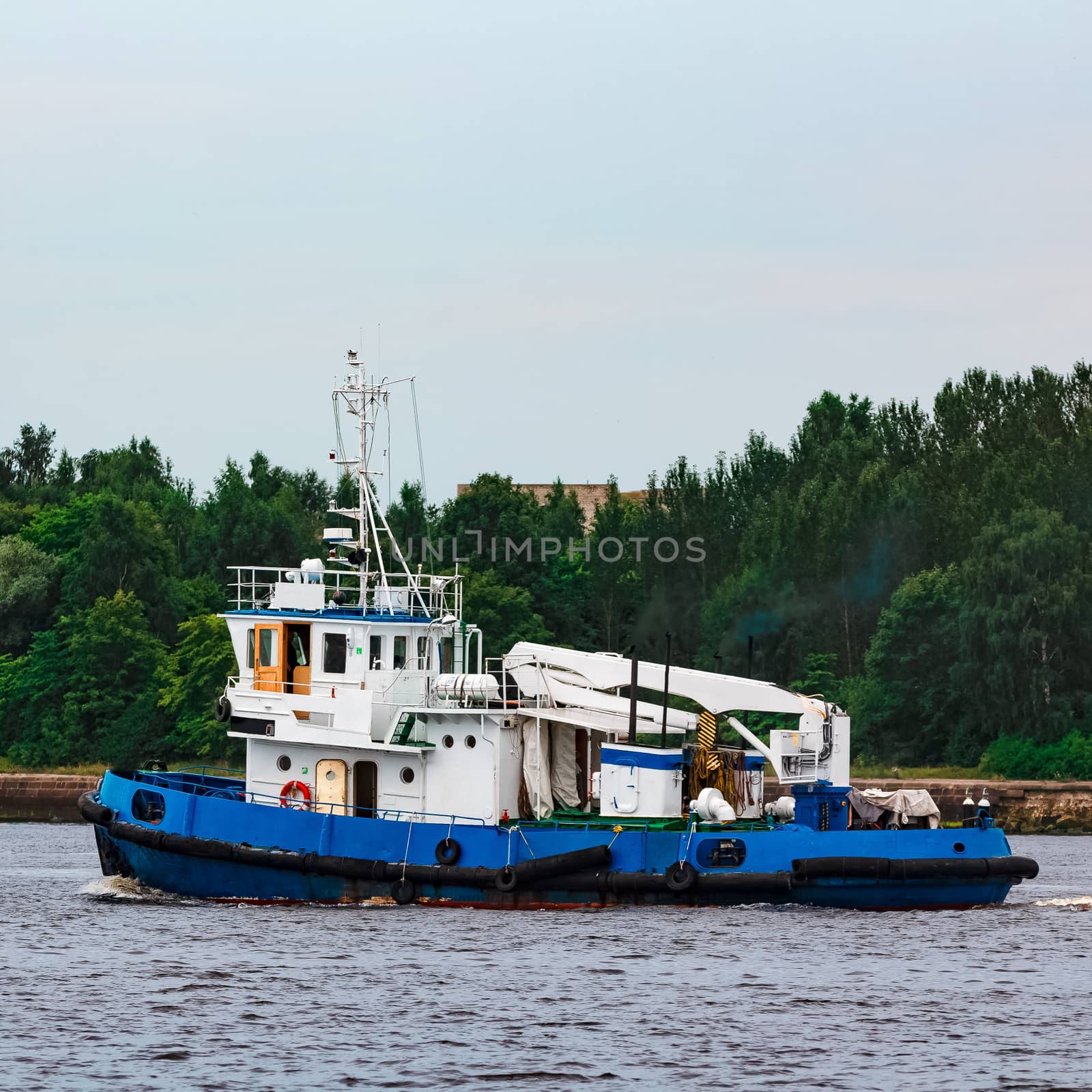 Blue tug ship underway by sengnsp