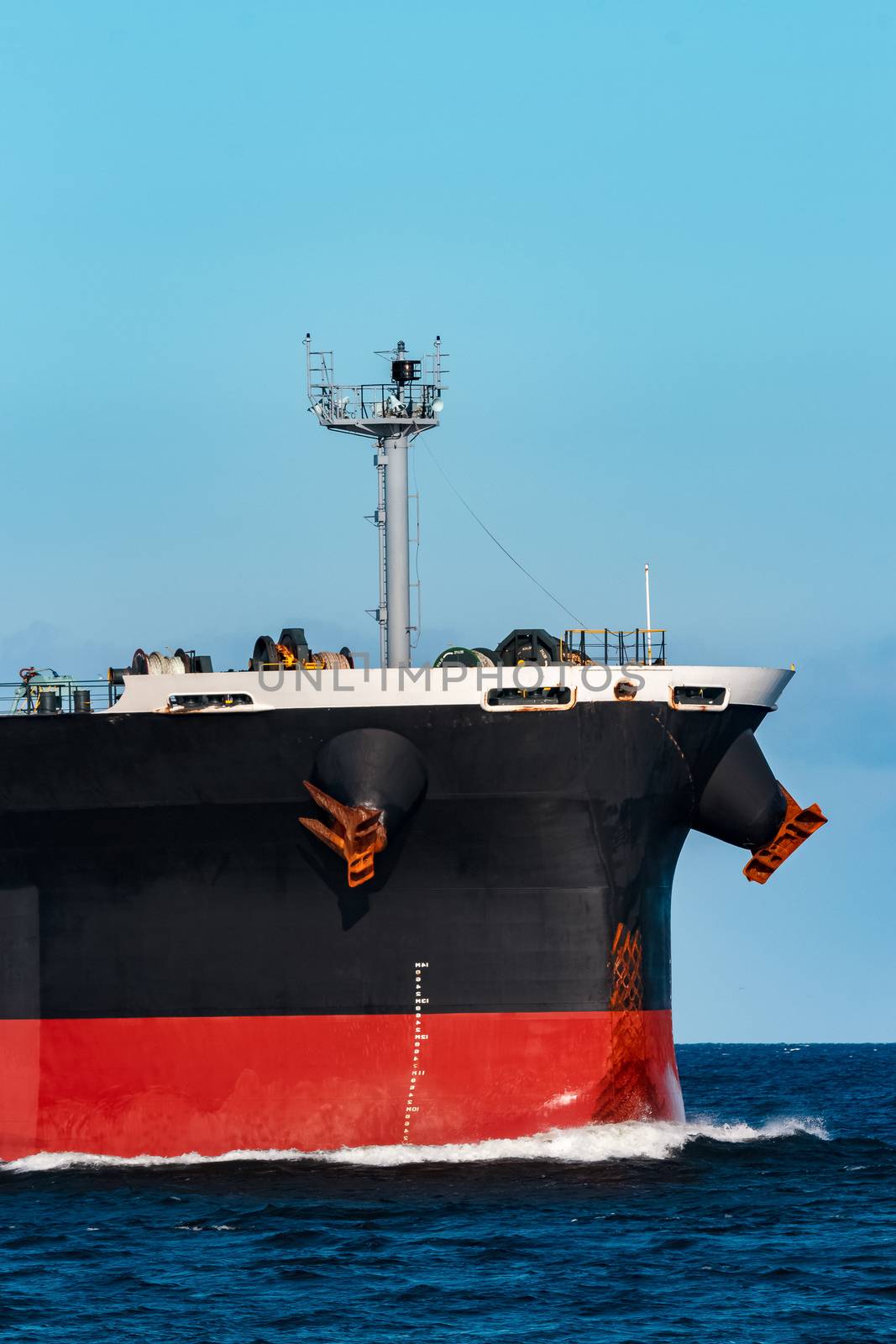 Black bulker ship. Logistics and merchandise transportations