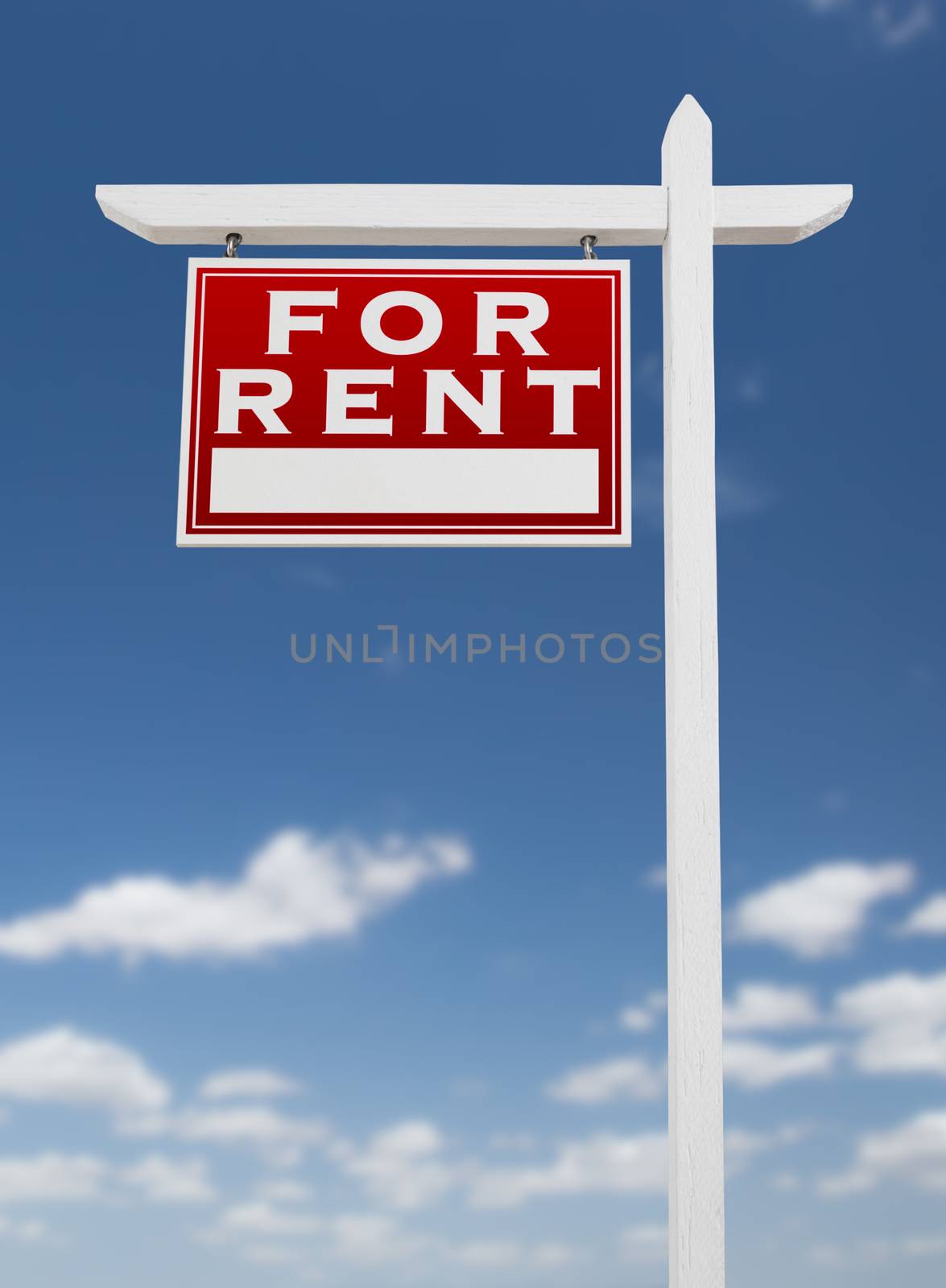 Left Facing For Rent Real Estate Sign on a Blue Sky with Clouds. by Feverpitched