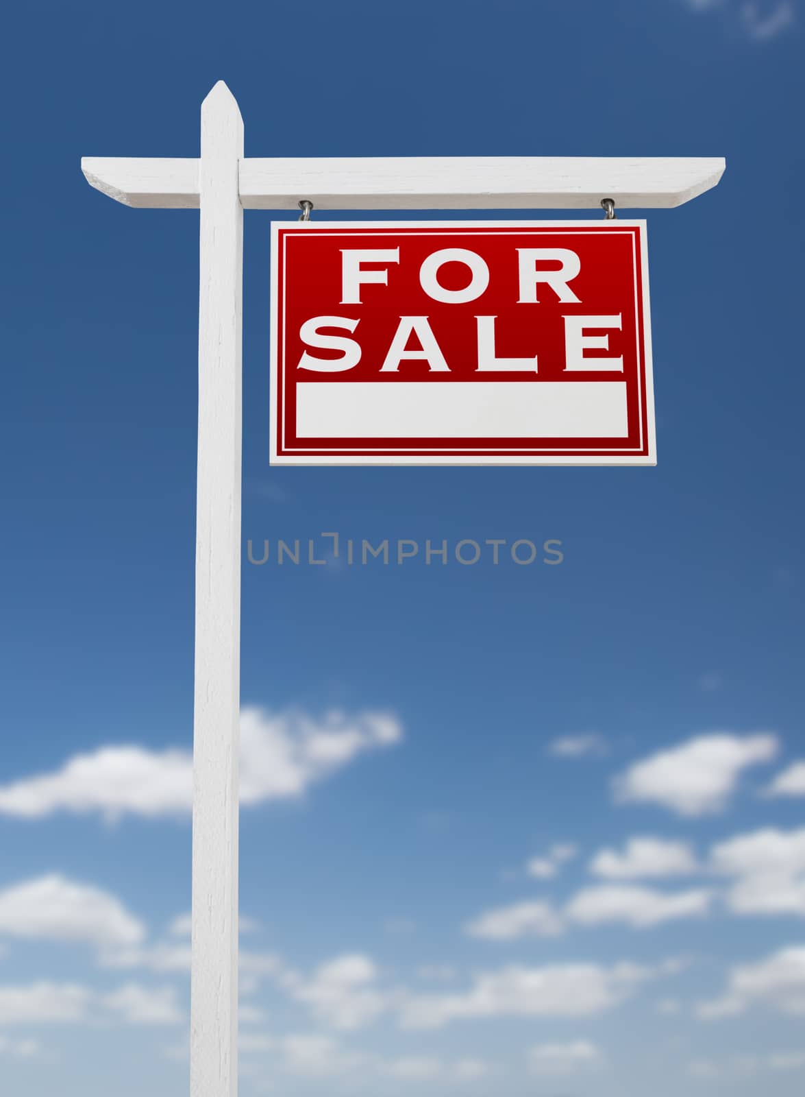Right Facing For Sale Real Estate Sign on a Blue Sky with Clouds by Feverpitched