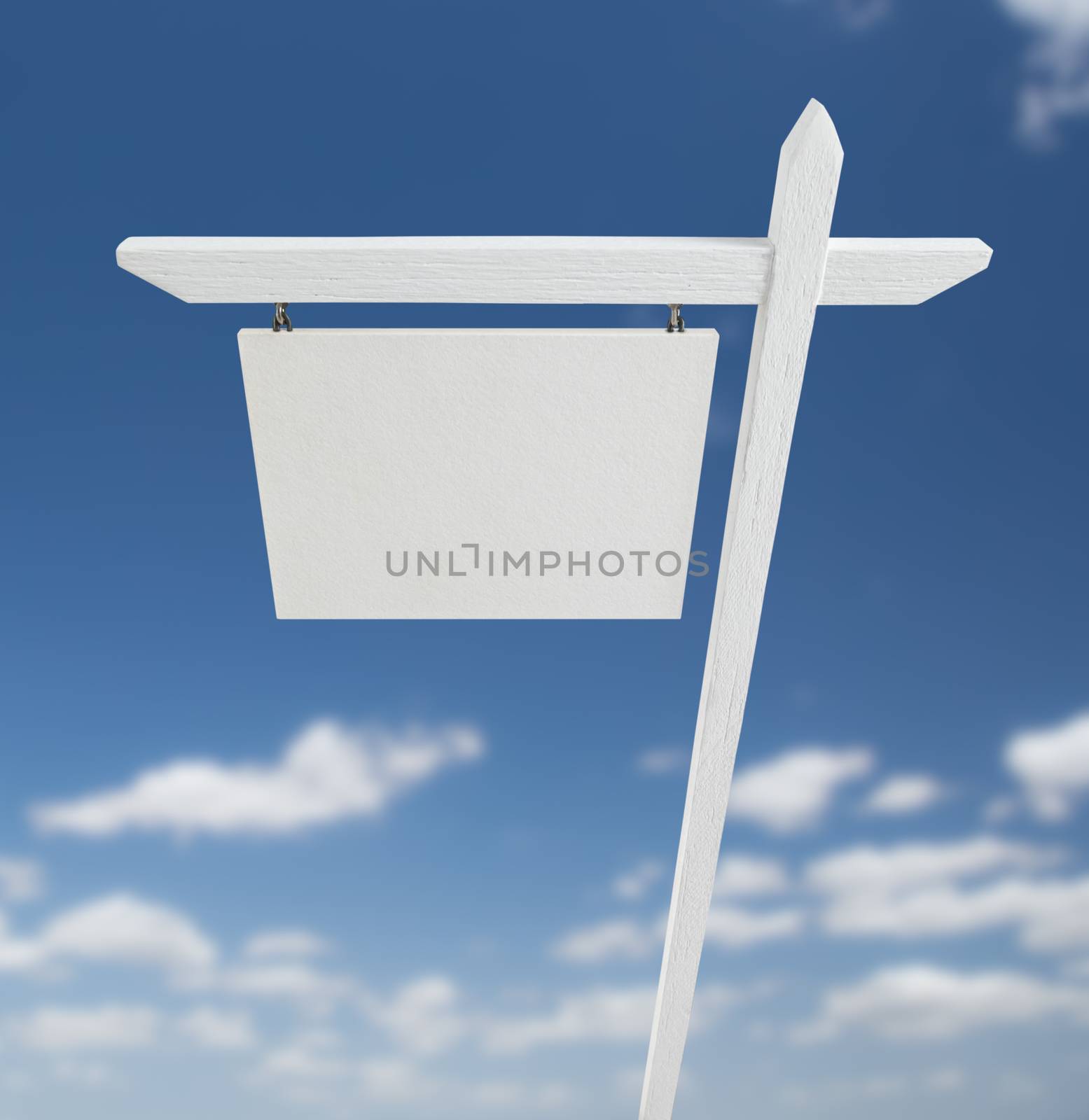 Blank Real Estate Sign Over A Blue Sky with Clouds. by Feverpitched