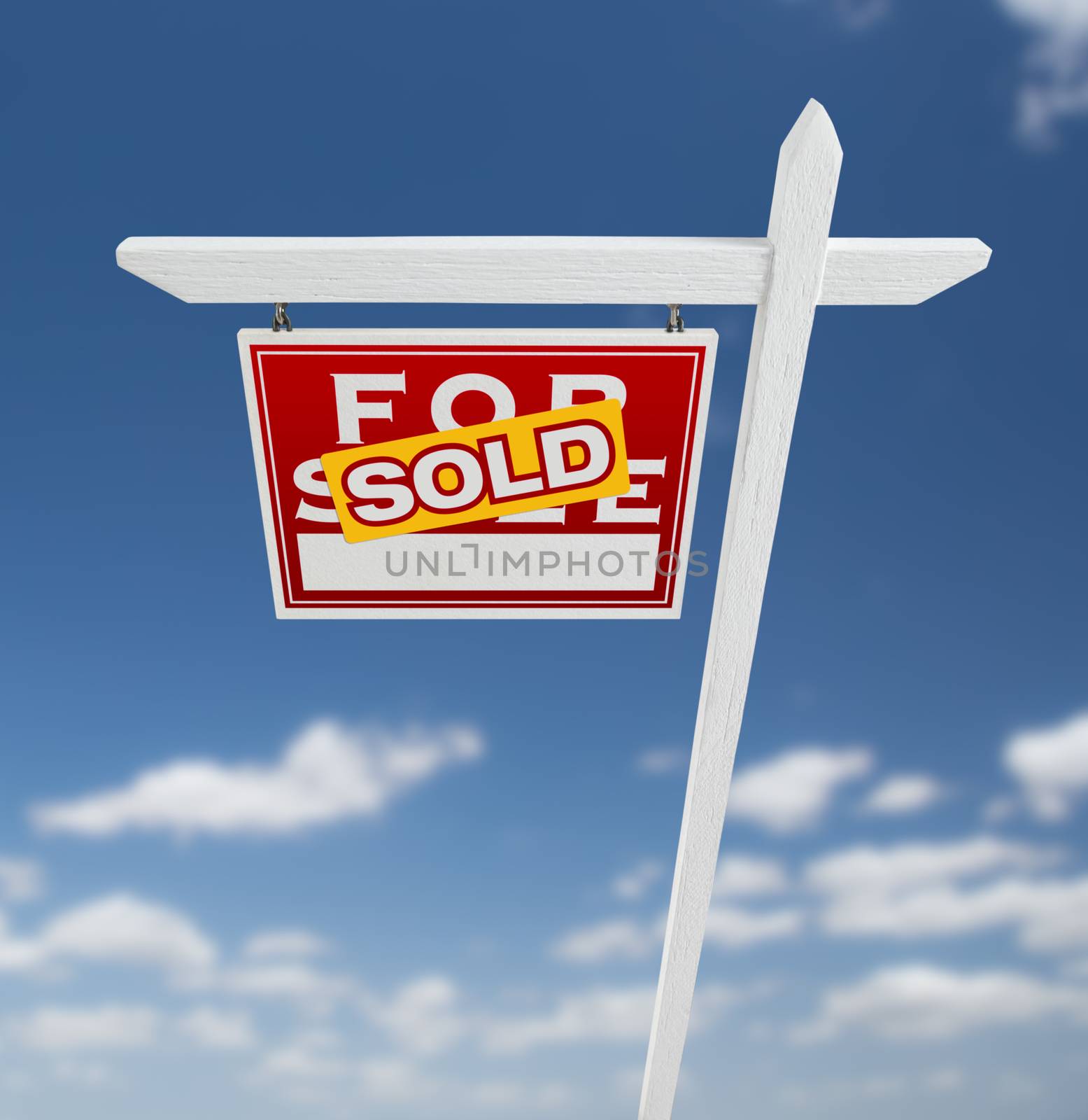 Left Facing Sold For Sale Real Estate Sign on a Blue Sky with Clouds. by Feverpitched