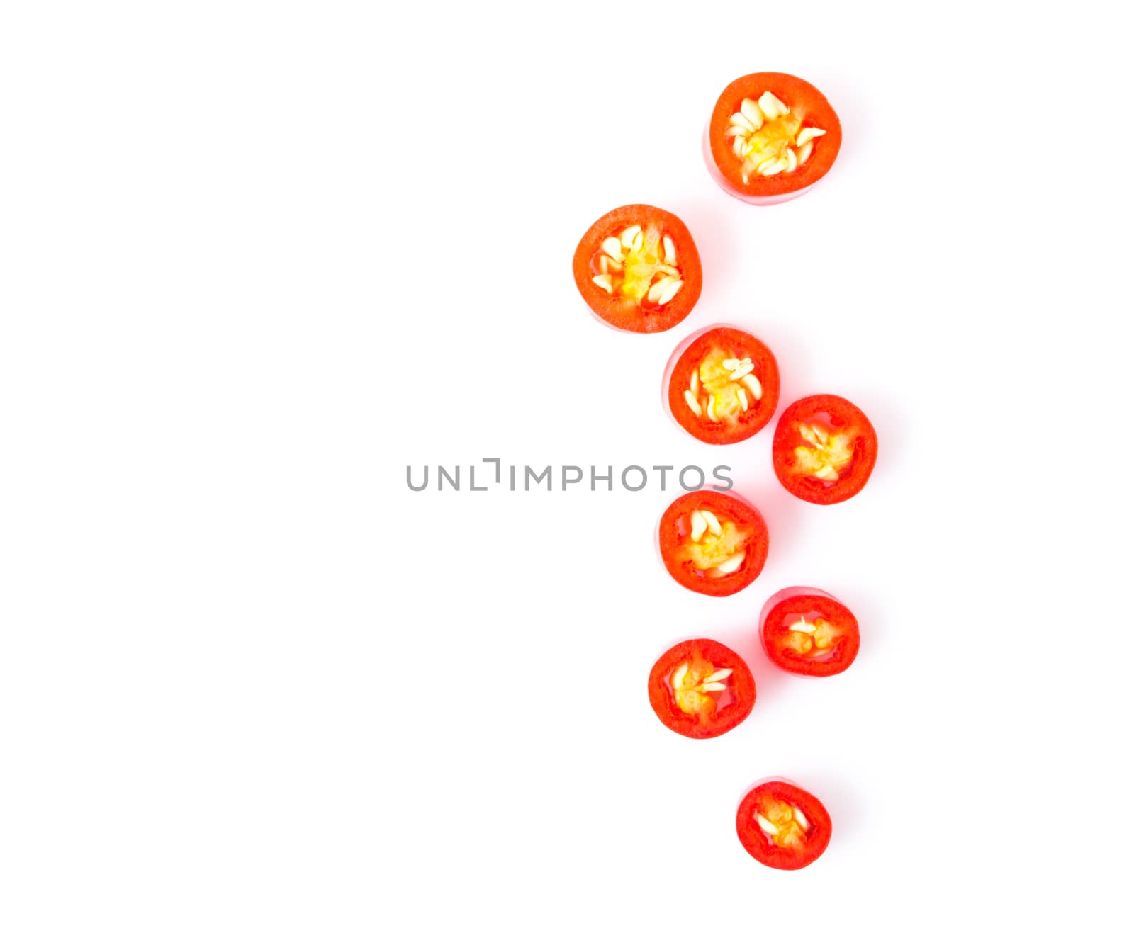 Closeup top view red chili pepper with sliced on white background, raw food ingredient concept