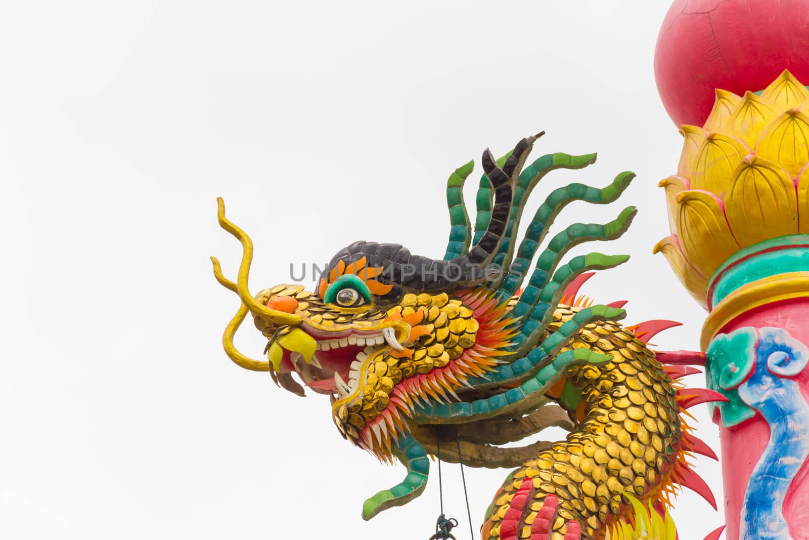 Beautiful chinese dragon statue with gray sky background.