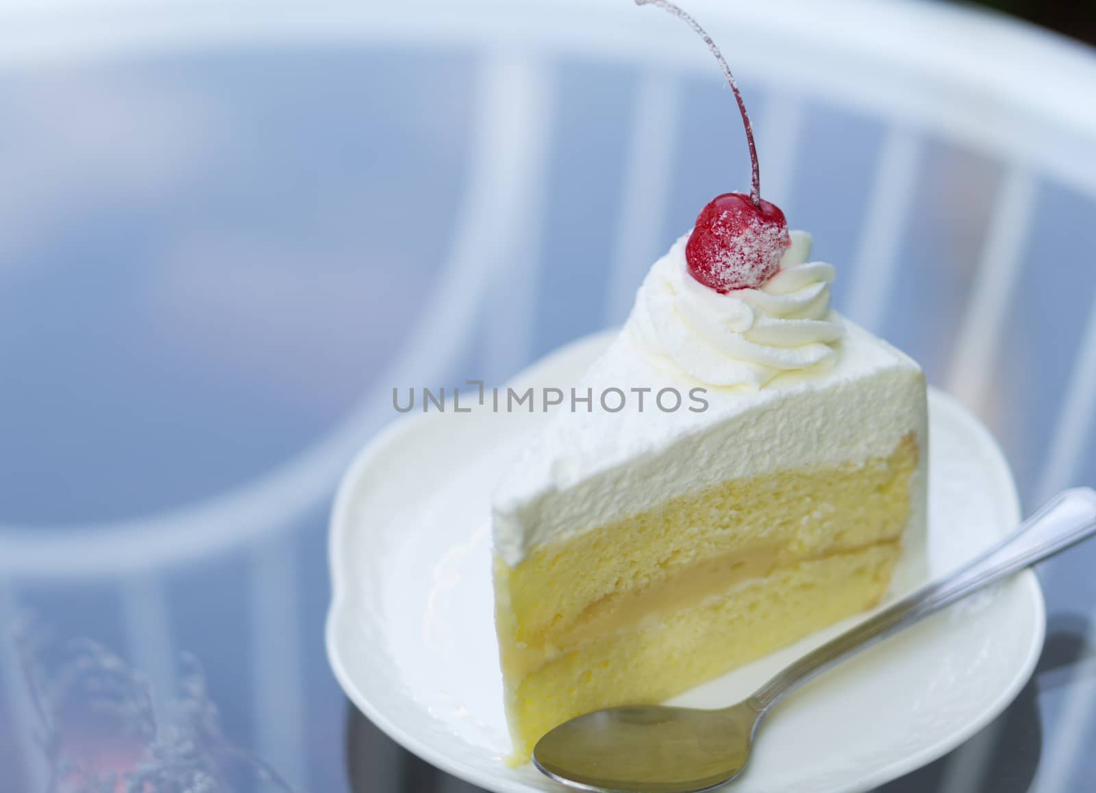 Closeup Milk cake delicious on glass table background, selective focus