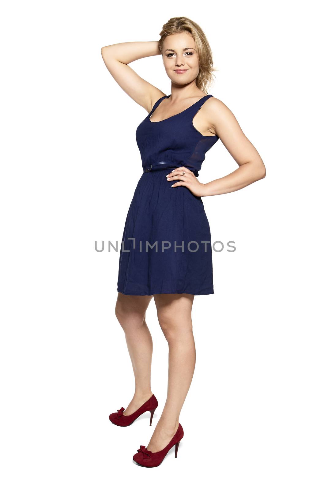 Cheerful young blonde woman in navy blue dress isolated on white background.