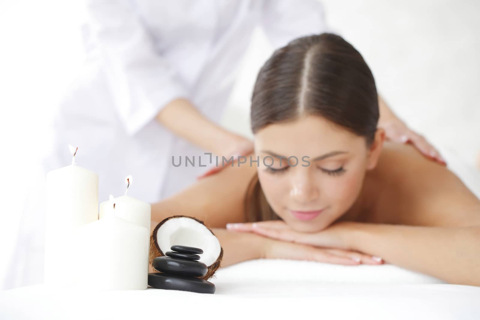 Beautiful young woman getting spa massage close up