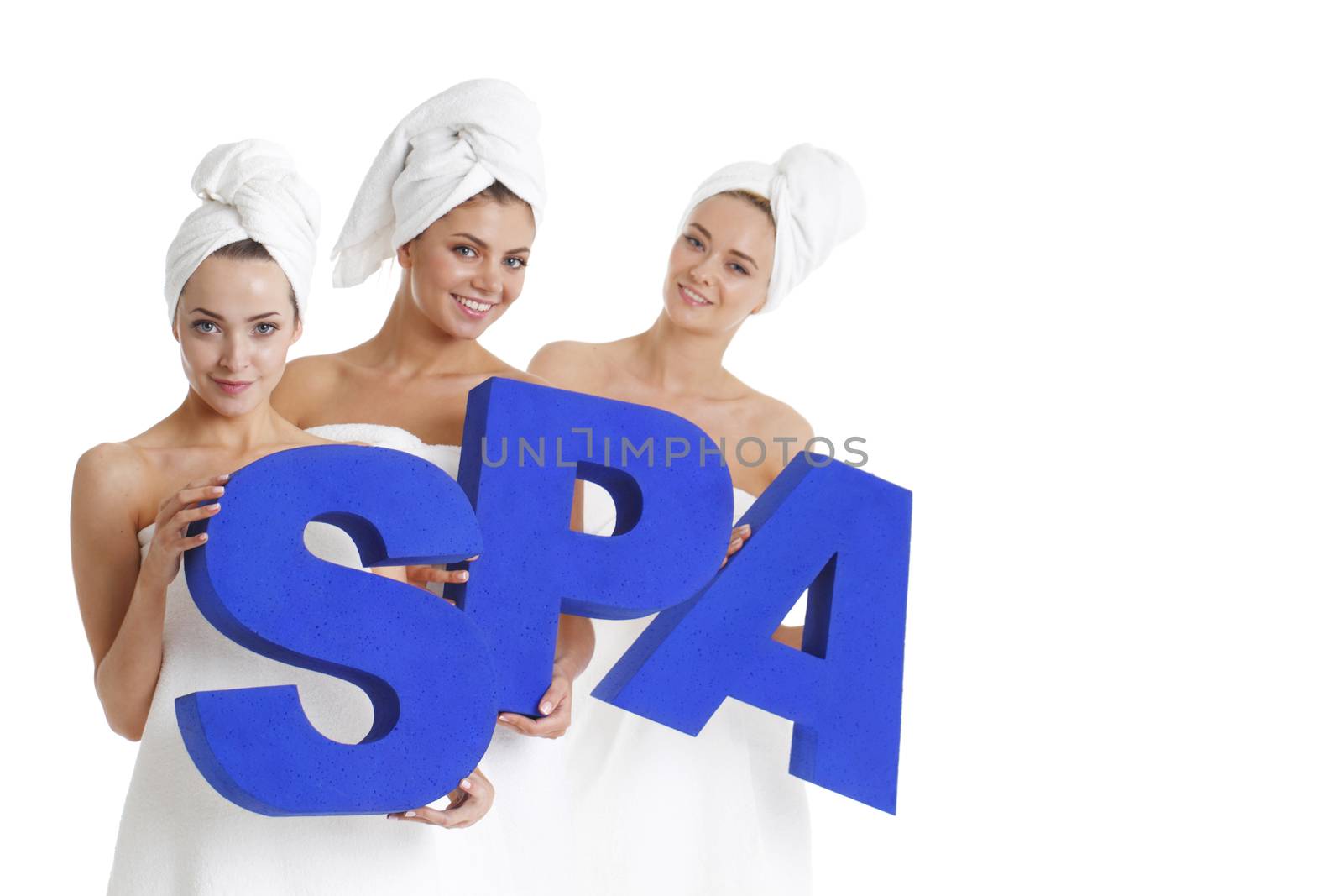 Women wrapped in towels holdin SPA letters isolated on white background