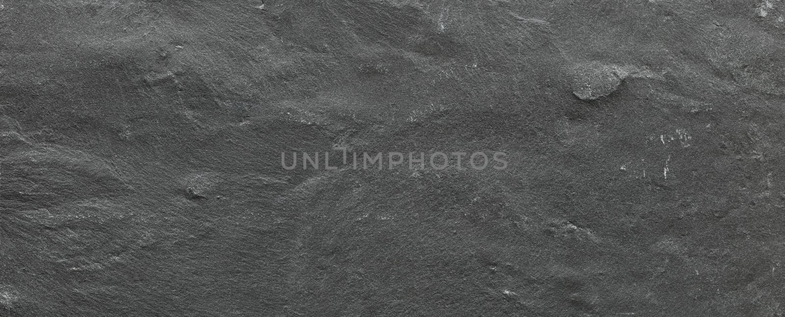 Dark grey ore black slate background or texture. Dark stone background, stone texture.