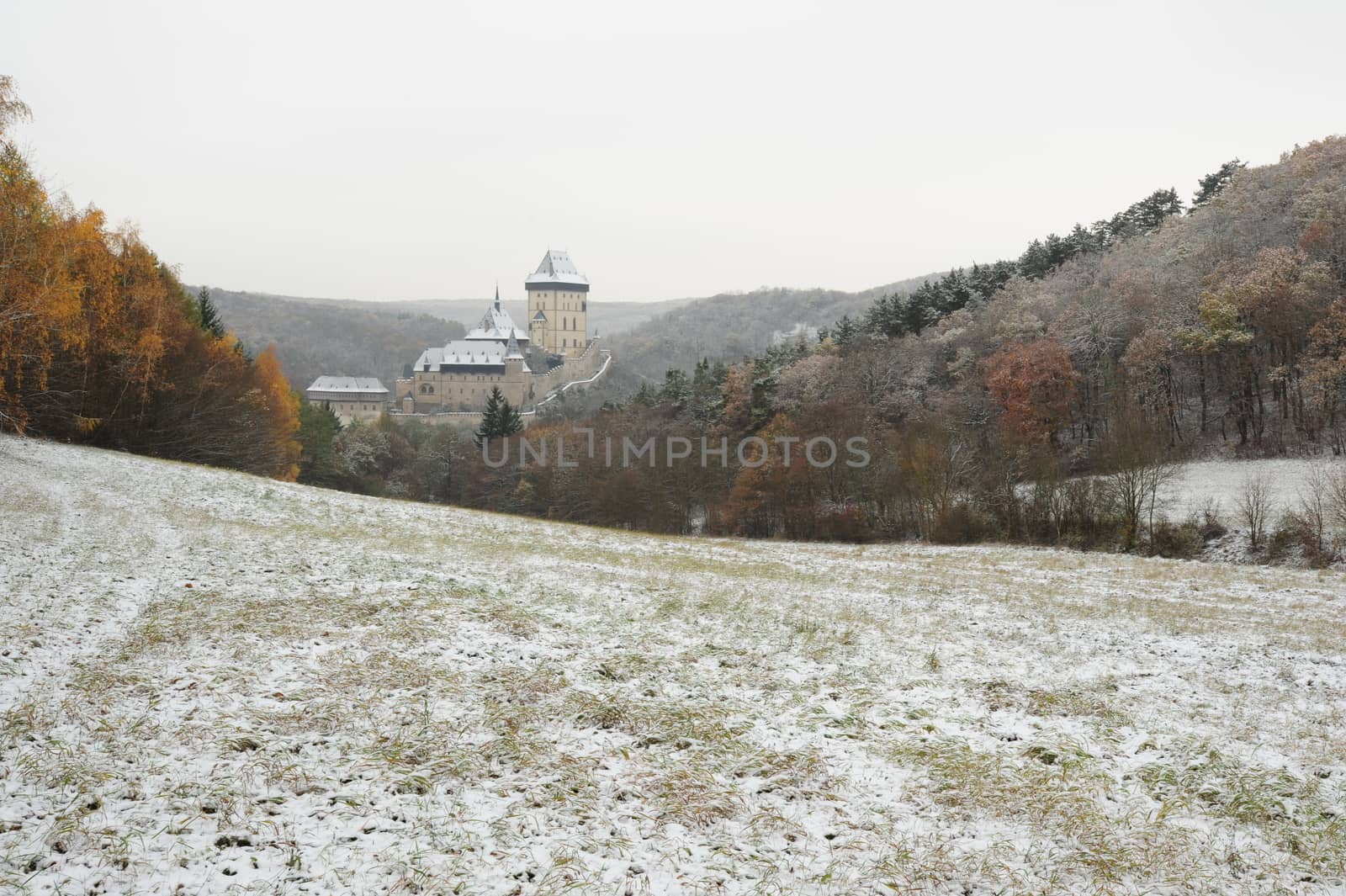 View of a snowy winter landscape with a castle Karlstejn