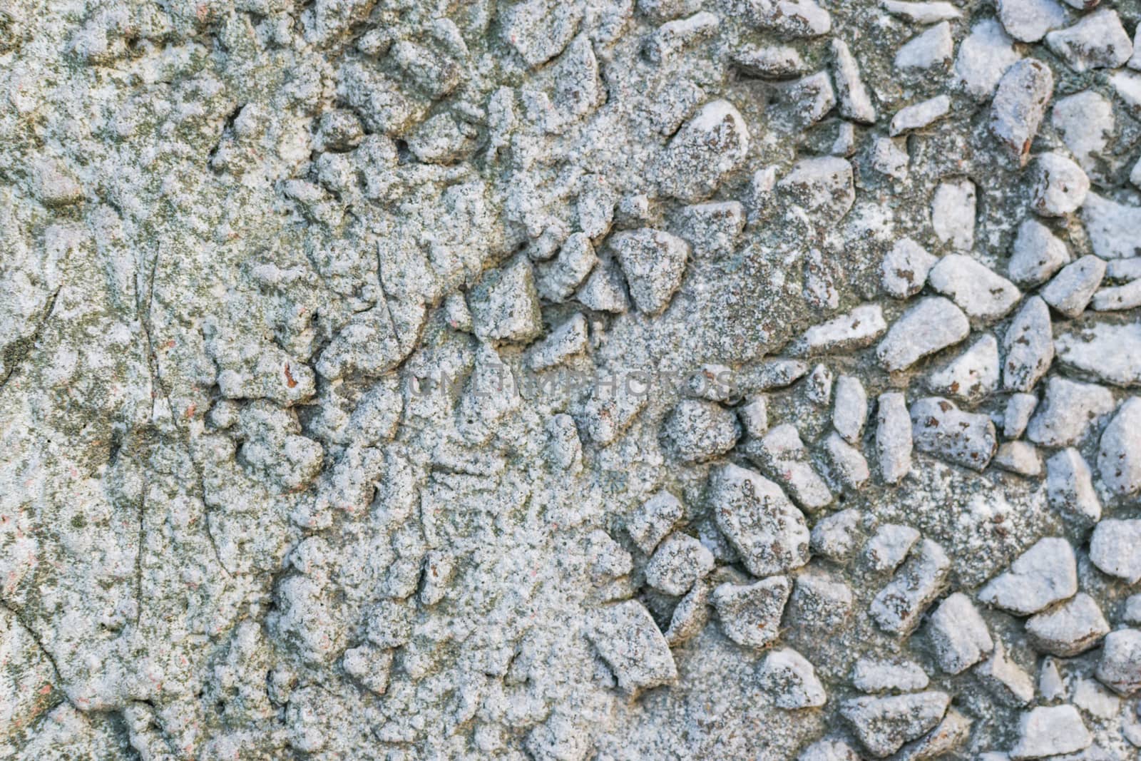 the texture of the stone in plaster red stones on a white background