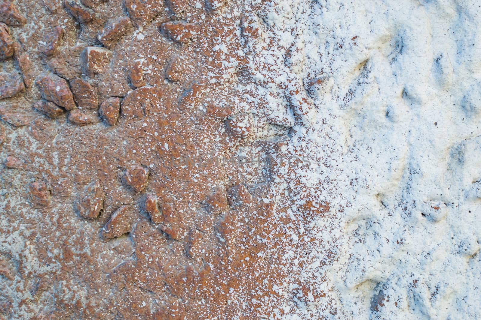 the texture of the stone in plaster red stones on a white background