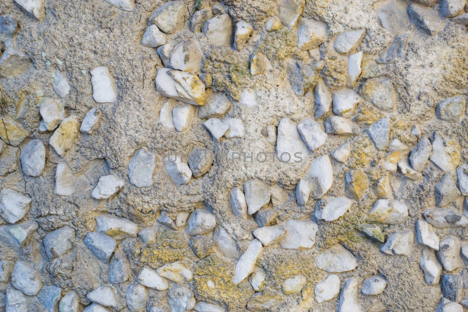 the texture of the stone in plaster red stones on a white background