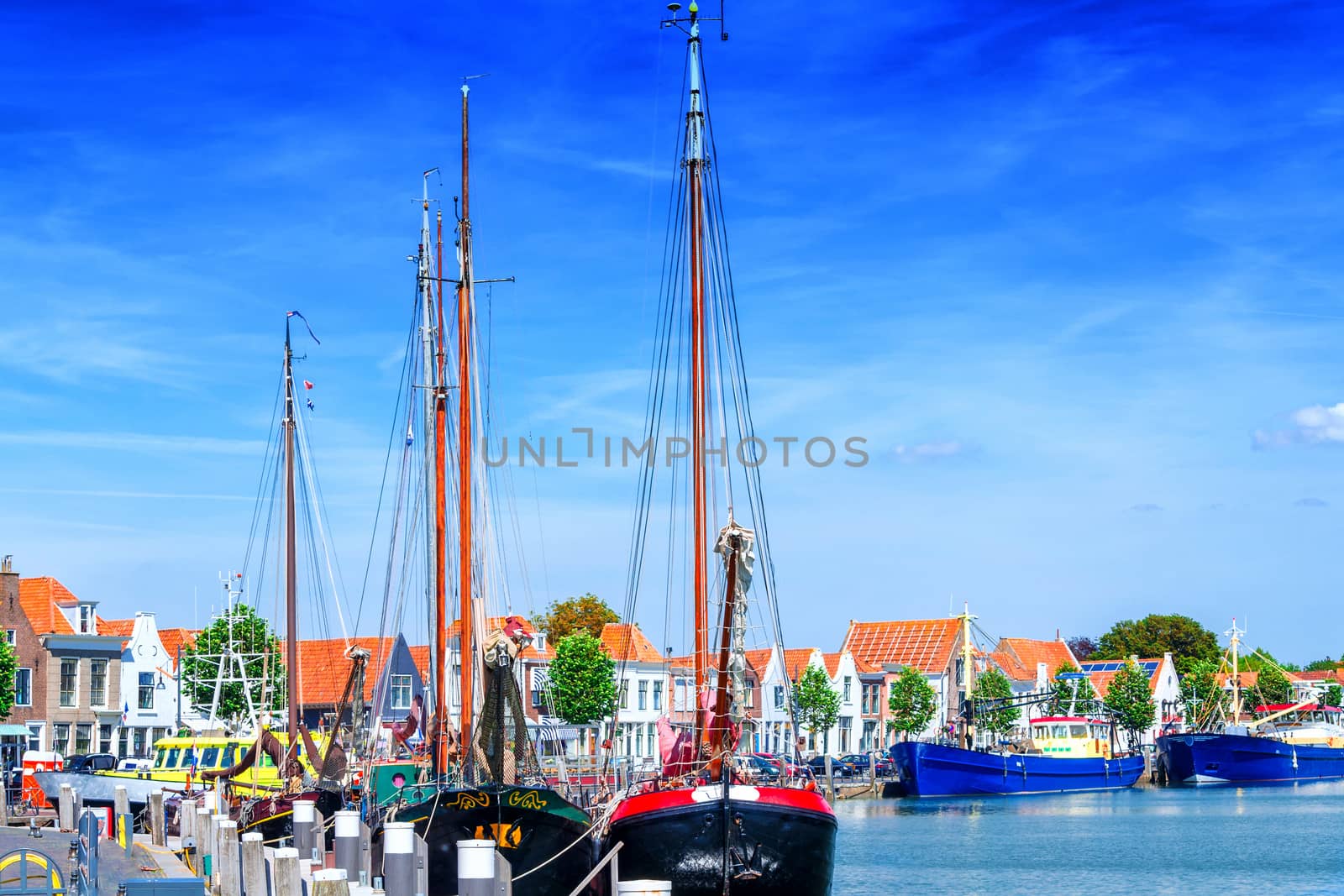 Dutch flat bottom boats, sailing boats in a harbor, in Holland Ziereksee. Province of Zeeland, The Netherlands.