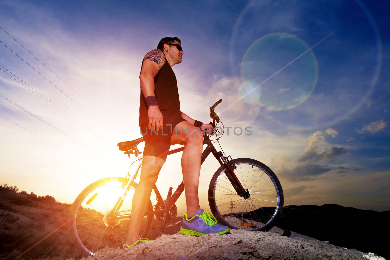 Sport and healthy life.Mountain bike and landscape background by carloscastilla