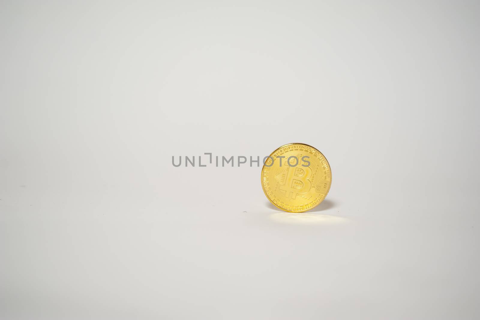 electronic money bitcoin over white background