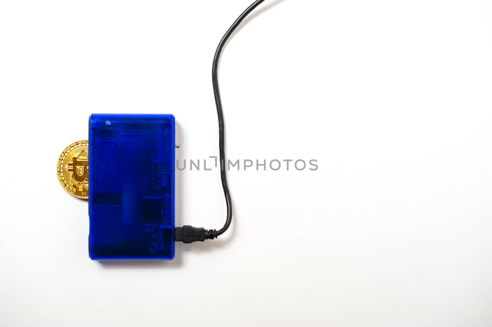 bitcoin electronic coin inside a digital card reader, white background