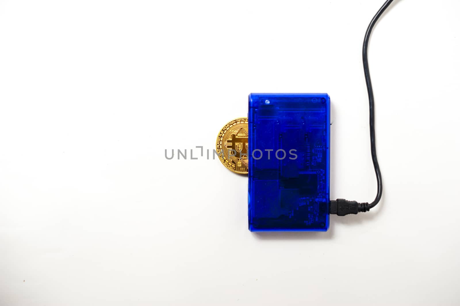 bitcoin electronic coin inside a digital card reader, white background