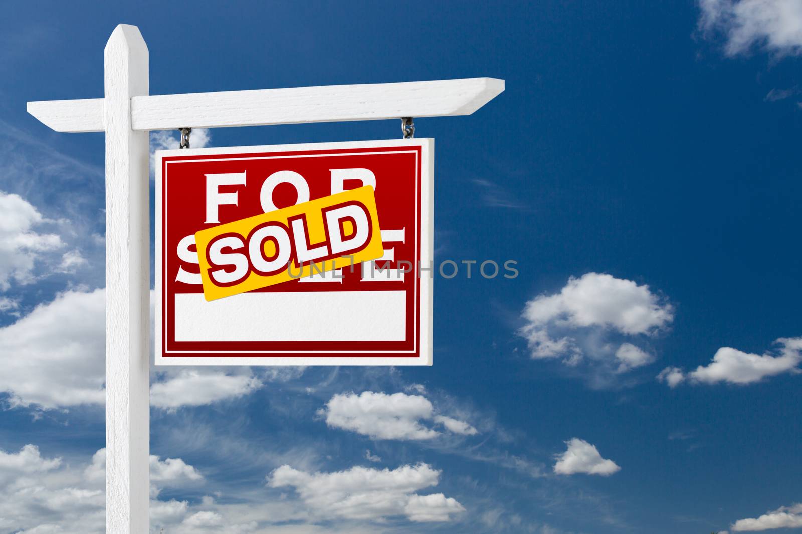 Right Facing Sold For Sale Real Estate Sign Over Blue Sky and Cl by Feverpitched