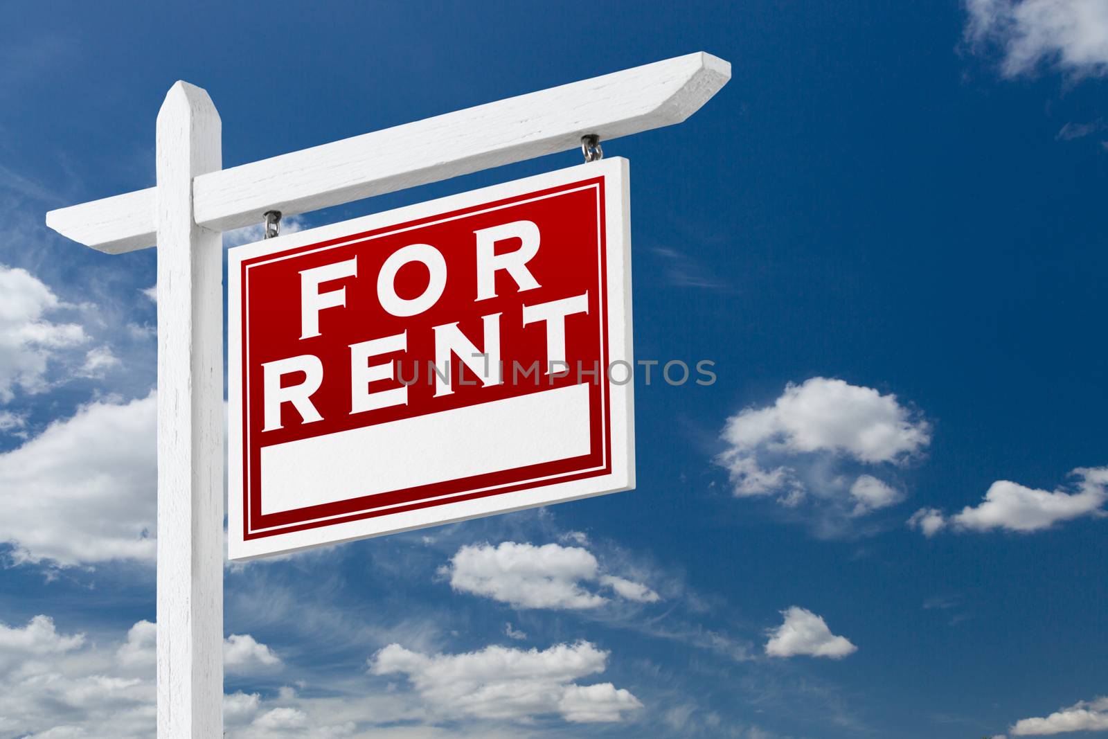 Right Facing For Rent Real Estate Sign Over Blue Sky and Clouds  by Feverpitched