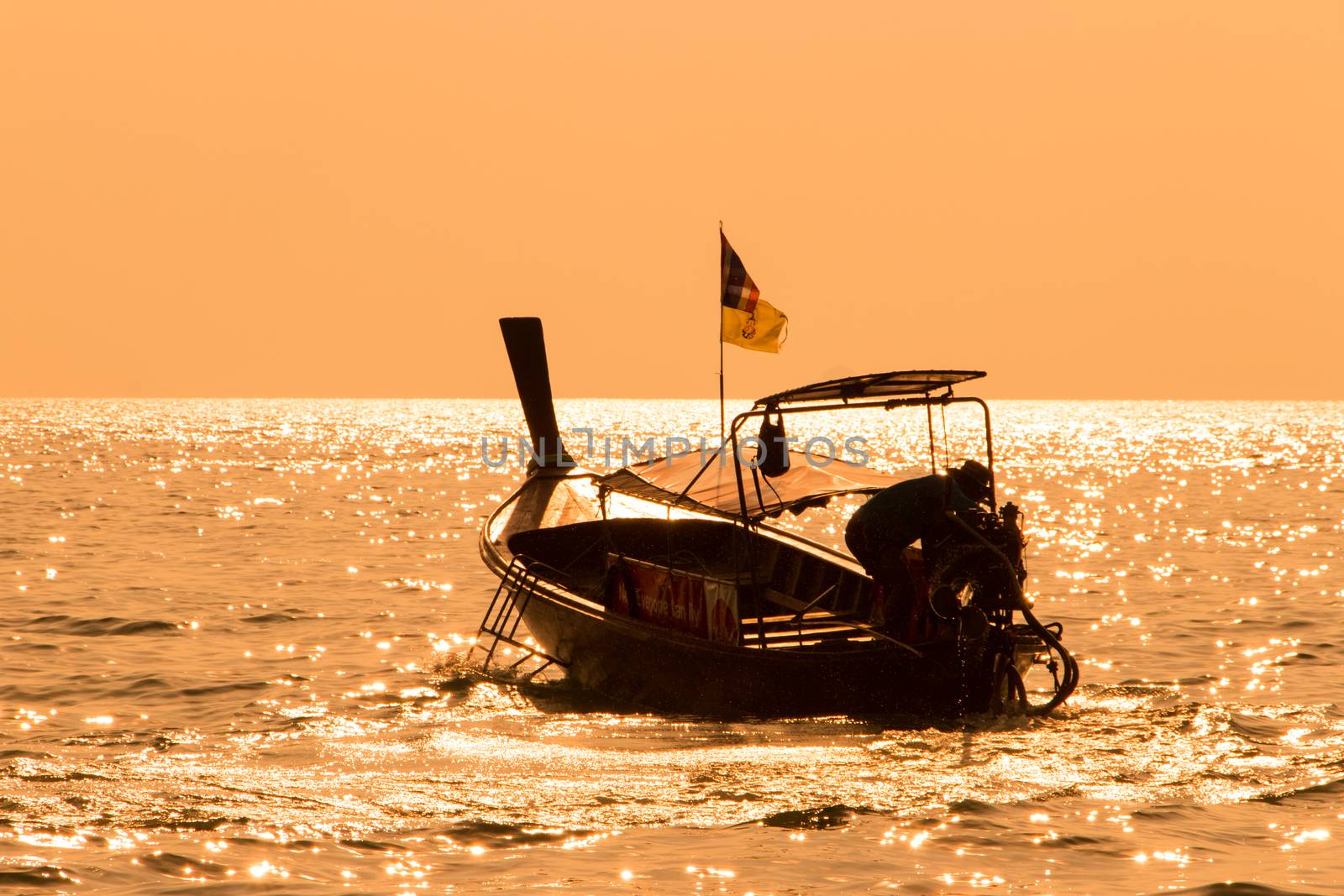 Longtail Boat In Phuket Thailand During Sunset by stuartmiles