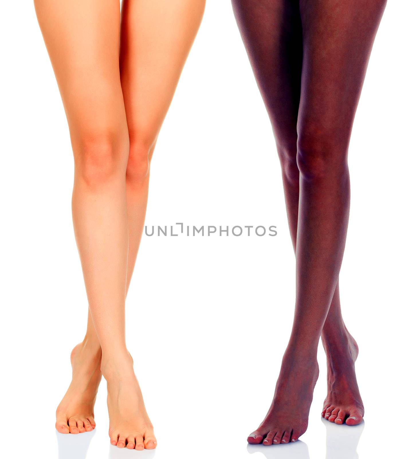 Long woman legs of black and caucasian girls isolated on white b by Nobilior