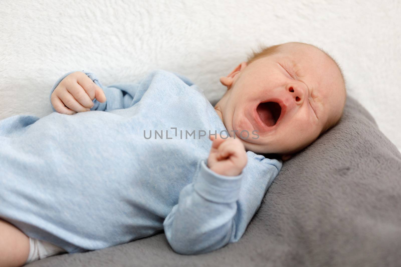 crying newborn baby - the first month of the new life