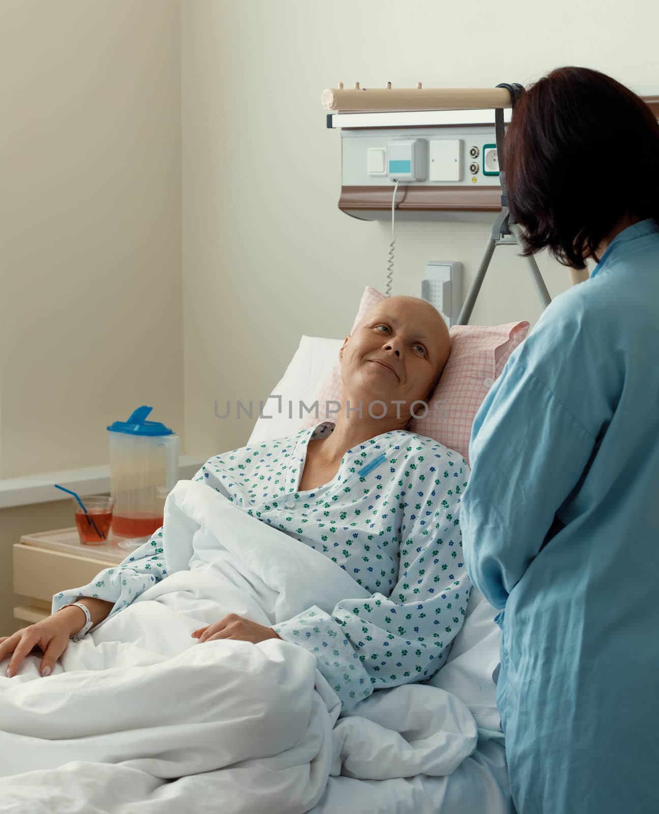 woman patient with cancer in hospital with friend by artush